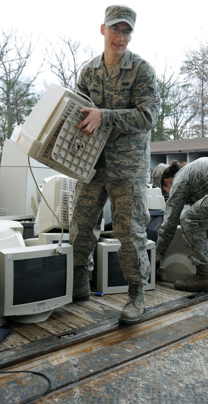 Airman 1st Class Cody Lugimbill, 11th Civil Engineer Squadron structural apprentice, unloads the first of several truckloads of out-dated and unused computer equipment from his shop to turn in to the Defense Reutilization and Marketing Office as part of the base-wide cleanup March 11.  The spring cleaning effort afforded all agencies on JBA the chance to rid their offices and workspaces of clutter. (U.S. Air Force photo by Senior Airman Torey Griffith)