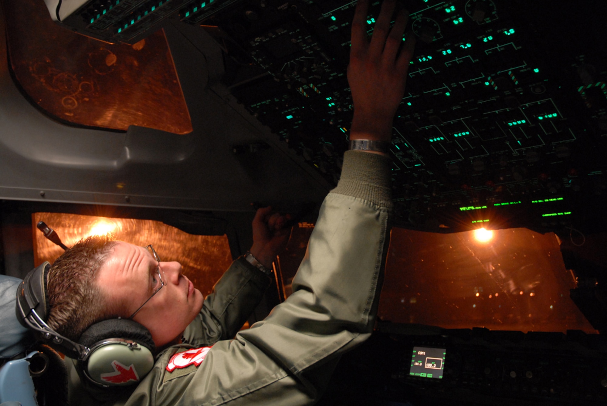 Joint Base Elmendorf-Richardson, Alaska -- C-17 Pilot, Air Force Capt. Charley Morris stationed at the 517th Airlift Squadron, Joint Base Elmendorf-Richardson Alaska, preps for flight caring humanitarian relief supplies to Misawa Air Base Japan. (U.S. Air Force photo/Staff Sgt. Mark Leahy)