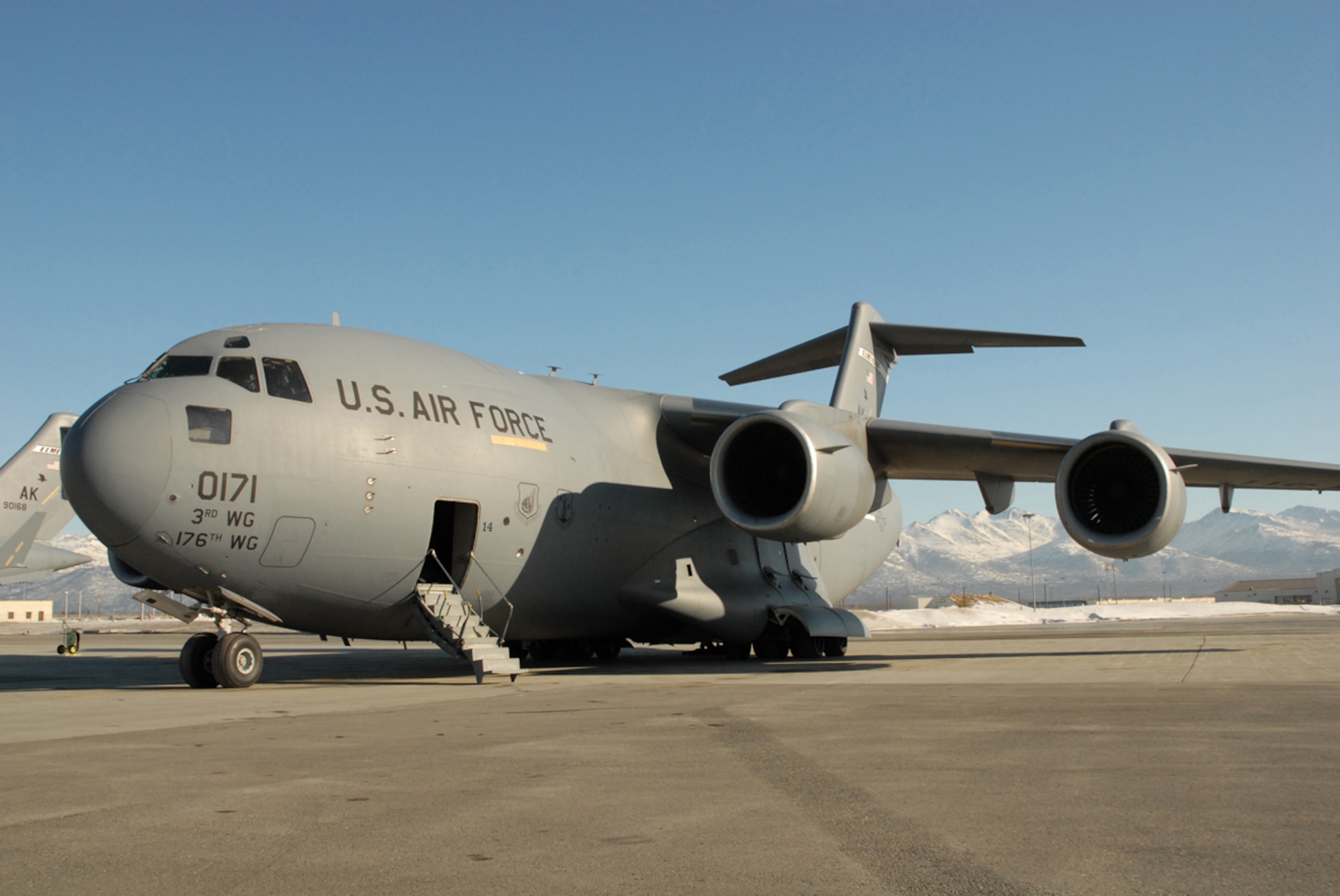Joint Base Elmendorf-Richardson, Alaska -- Air Force Capt. Jessica Regni, 517th Airlift Squadron C-17 Globemaster III pilot does pre-flight checks before flying to Japan for humanitarian relief efforts, March 12, 2011. (U.S. Air Force photo/Staff Sgt. Mark Leahy)