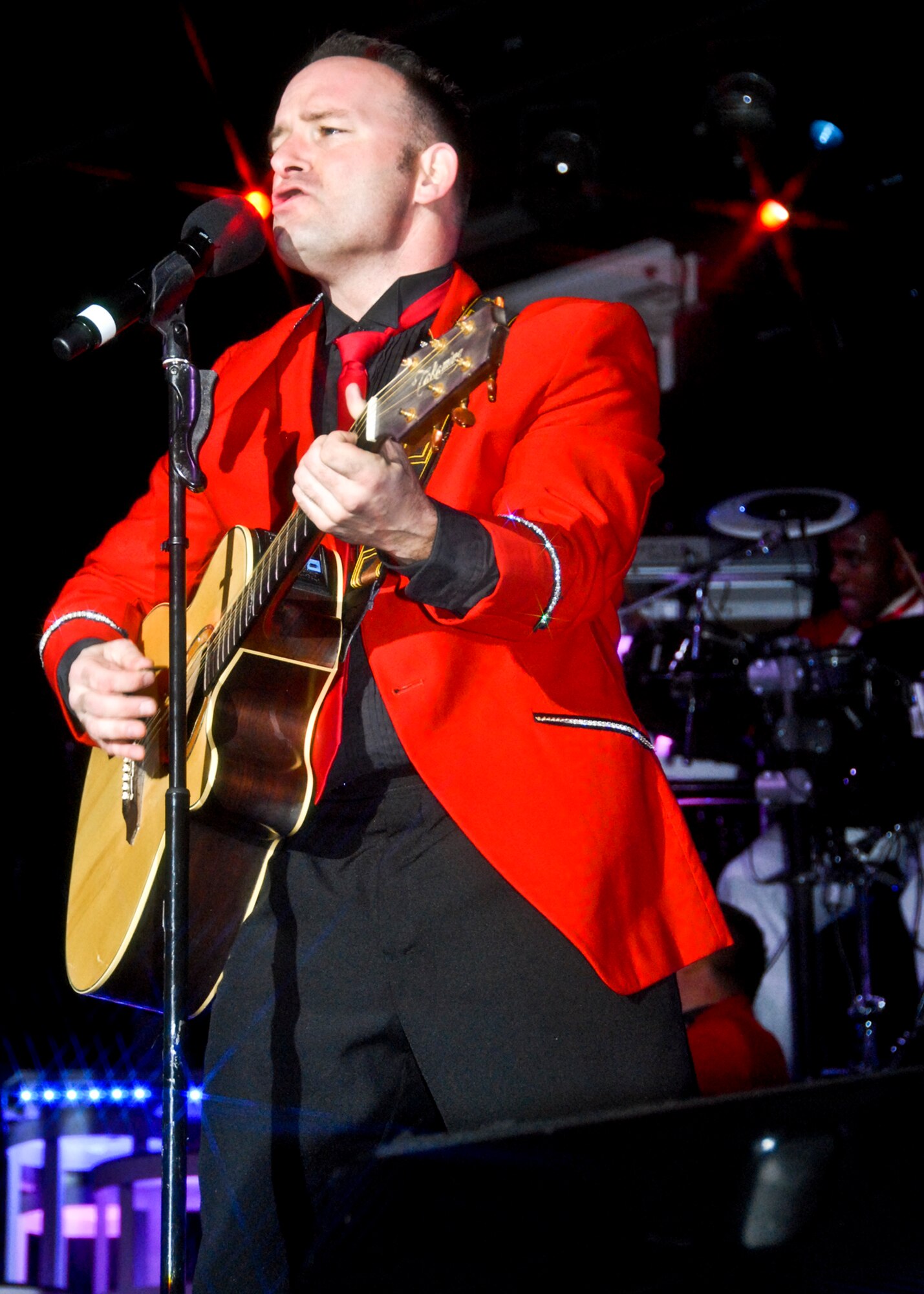 Master Sgt. Robert Clarks rocks the crowd at the Tops in Blue concert March 12 at Northwest Florida State College. Several hundred people came to see the Air Force special unit made up of 35-40 active duty performers. Tops in Blue is one of the oldest and most widely traveled entertainment groups of its kind. Their current tour entitled “We Believe” is traveling throughout the United States and to more than 25 countries over a 10-month period. (U.S. Air Force photo/Sachel Seabrook)