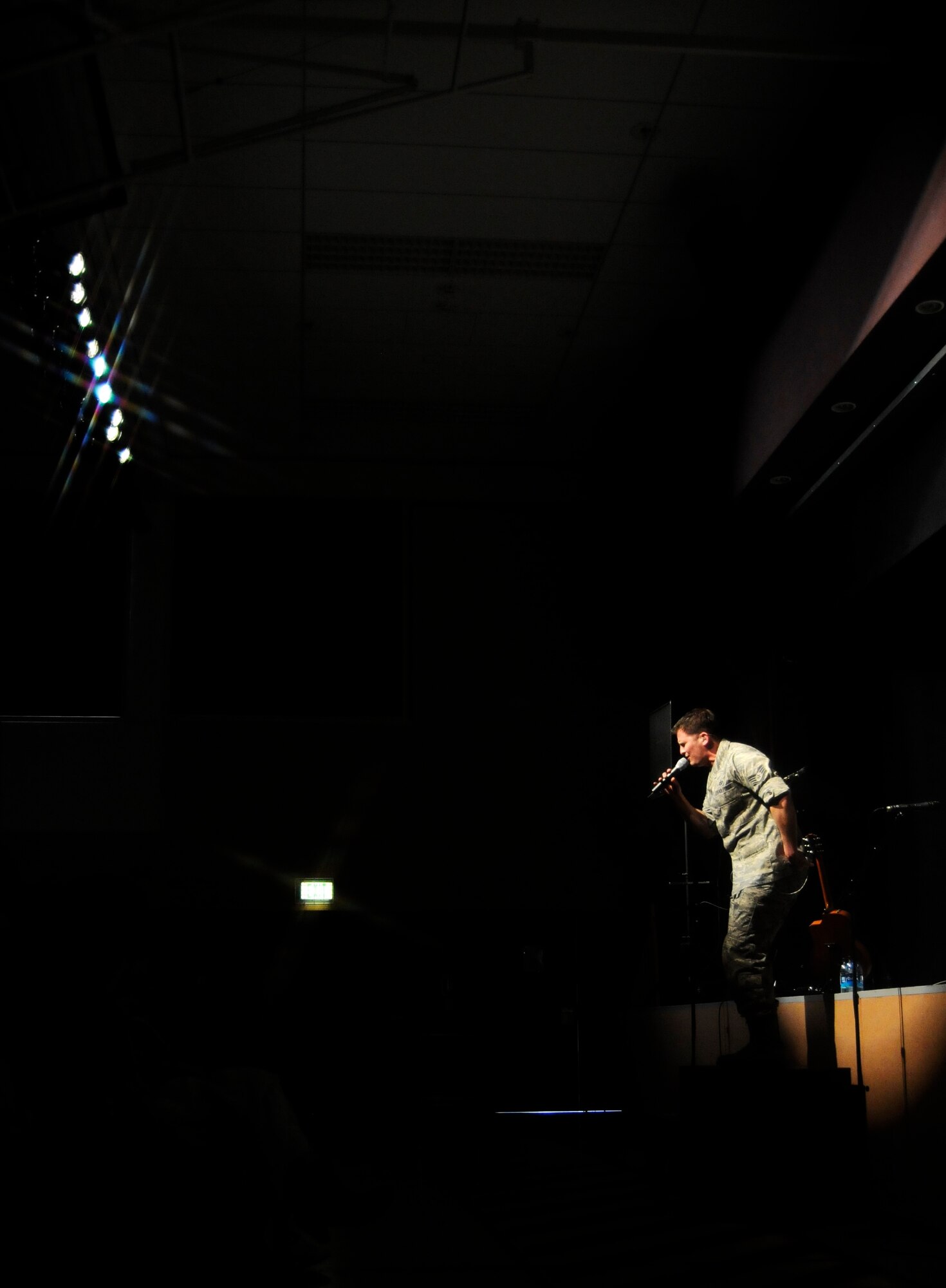VILSECK, Germany – Staff Sgt. Craig Bowman, U.S. Air Forces in Europe Band Touch ‘n Go vocalist, sings to Vilseck High School students on U.S. Army Garrison Vilseck, Germany, during a performance March 10. Touch ‘n Go performed before a packed gymnasium of students and teachers at the school as part of a Music in Our Schools tour throughout Bavaria. Every March Touch ‘n Go, a six-person rock band, dedicates their time to bringing music to schools. Year round, they also perform community relations events for embassies, deployed service members and various military and non-military events. (U.S. Air Force photo/Staff Sgt. Kali L. Gradishar)