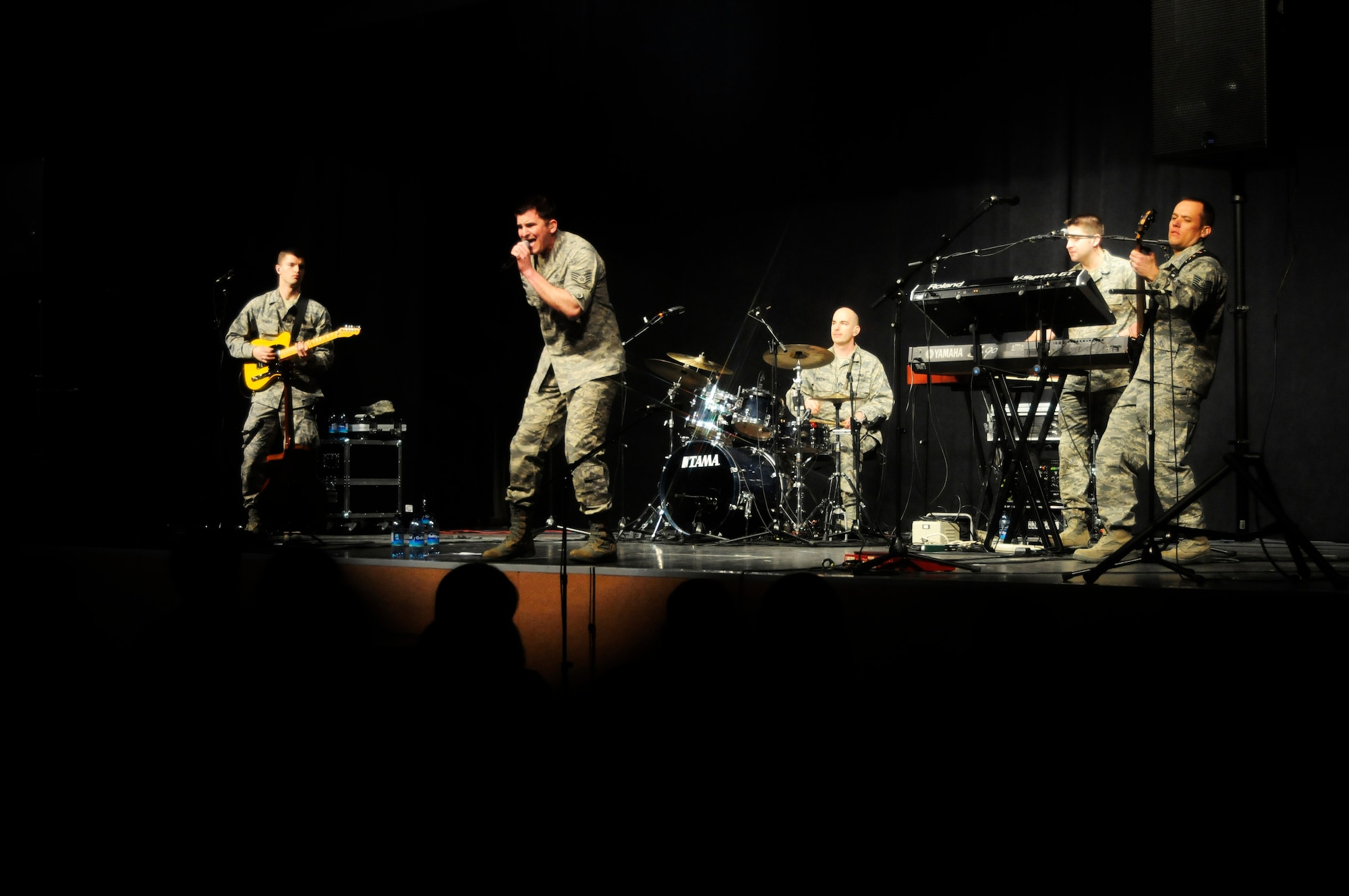VILSECK, Germany -- The U.S. Air Forces in Europe Band Touch ‘n Go performs for a gymnasium packed with Vilseck High School students and teachers on U.S. Army Garrison Vilseck, Germany, March 10. Touch ‘n Go performed before a packed gymnasium of students and teachers at the school as part of a Music in Our Schools tour throughout Bavaria. Every March Touch ‘n Go, a six-person rock band, dedicates their time to bringing music to schools. Year round, they also perform community relations events for embassies, deployed service members and various military and non-military events. (U.S. Air Force photo/Staff Sgt. Kali L. Gradishar)