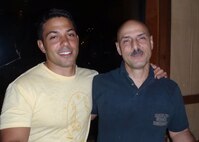 Army Capt. Nick Albini and his father, Air Force Reserve Chief Master Sgt. Paul Albini, 919th Special Operations Wing, pose for a photo during a South Florida premiere of Discovery Channel's reality series, "Out of the Wild: Venezuela," in which the captain is a cast member.  Captain Albini credits his father, a career munitions specialist at Duke Field, Fla., for instilling the attributes necessary to be successful in life as well as his challenges in the popular TV series. (Courtesy photo)