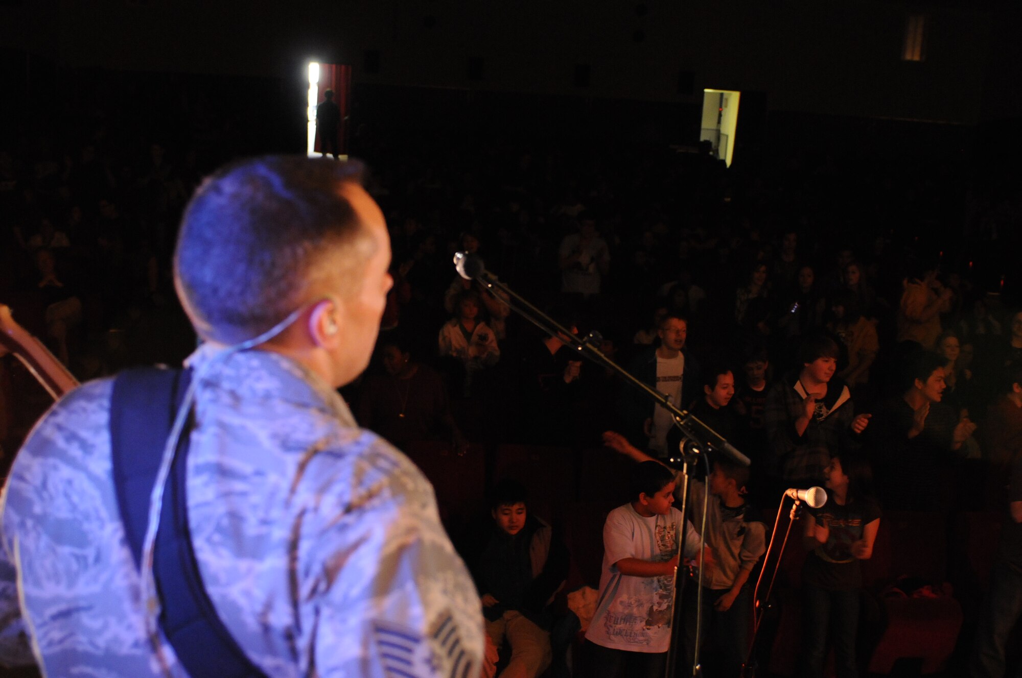 BAMBERG, Germany – Tech. Sgt. Mark Frandsen, U.S. Air Forces in Europe Band Touch ‘n Go NCO in charge and bassist, performs for Bamberg Middle and High School students March 11 at U.S. Army Garrison Bamberg, Germany. Touch ‘n Go, a six-person rock band, performed before a packed theater of students and teachers at the school as part of a Music in Our Schools tour throughout Bavaria. (U.S. Air Force photo/Staff Sgt. Kali L. Gradishar)