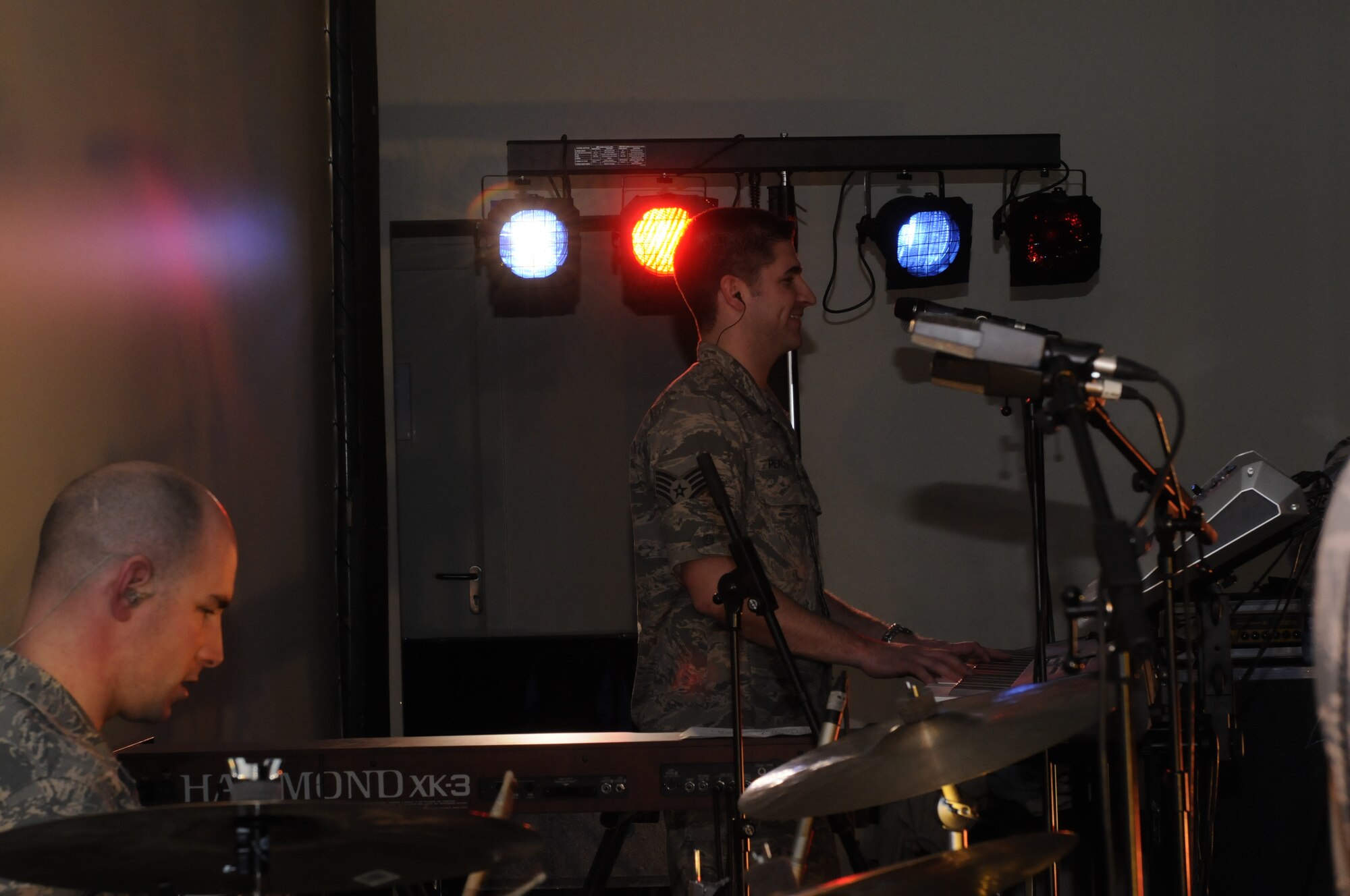 BAMBERG, Germany – U.S. Air Forces in Europe Band Touch ‘n Go band members Staff Sgt. Matthew Peacock, (right) pianist, and Staff Sgt. Jon Friedman, percussionist, perform for Bamberg Middle and High School students March 11 at U.S. Army Garrison Bamberg, Germany. Touch ‘n Go, a six-person rock band, performed before a packed theater of students and teachers at the school as part of a Music in Our Schools tour throughout Bavaria. (U.S. Air Force photo/Staff Sgt. Kali L. Gradishar)