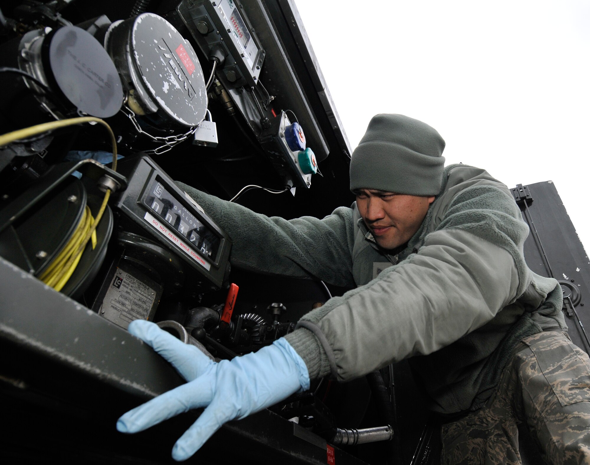 MISAWA AIR BASE, Japan – Staff Sgt. Michael Salas, 35th Logistics Readiness Squadron fuels distribution supervisor, monitors a fuel gauge on a fuel truck Mar.15. The fuel Sergeant Salas is using holds 1,200 gallons of fuel and can refill 20-25 generators in one load. (U.S. Air Force Tech. Sgt. Phillip Butterfield\Released) 