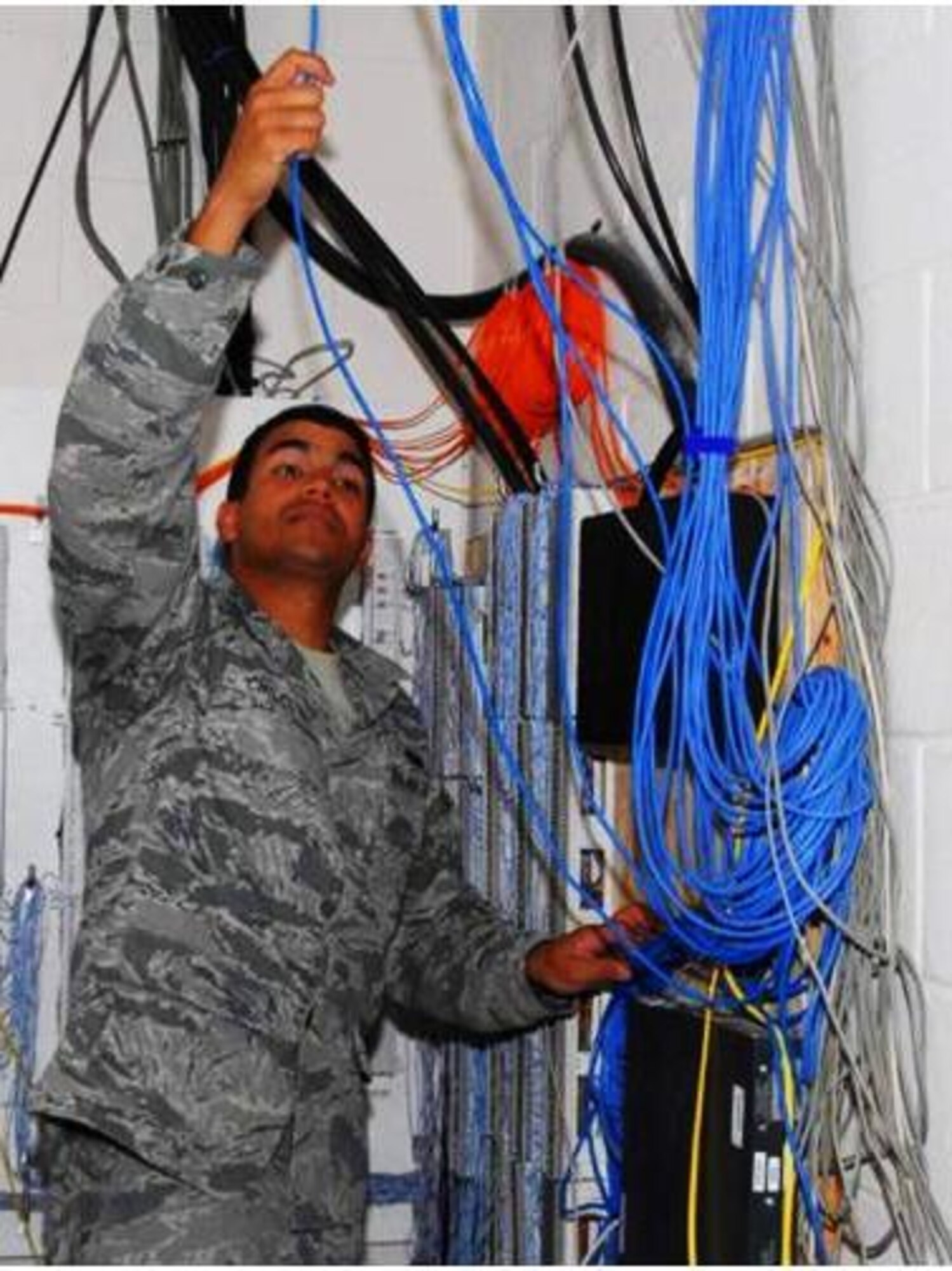 Staff Sgt. Creighton Chilcote is deployed from the 82nd Communications Squadron at Langley Air Force Base, Va., to serve with the 405th Air Expeditionary Group, 405th Expeditionary Support Squadron Communications Flight in Southwest Asia. As the NCO in charge of the inside/outside communications plant, he engineers, installs, maintains and repairs all base cabling, to include fiber optics, coax, cat5 and copper, for unclassified and classified systems.  (Courtesy photo)