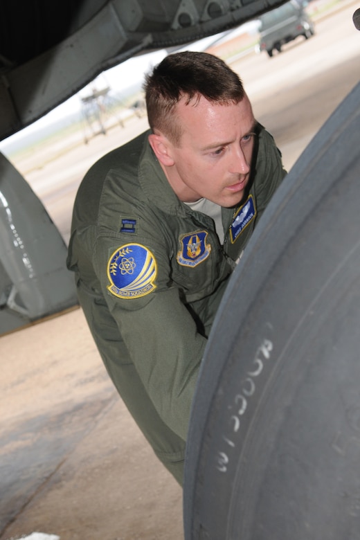 Capt. Chris Robinson, 343rd Bomb Squadron co-pilot, performs a hot brake check on a 2nd Bomb Wing B-52H as part of his post-flight inspection after returning from a nuclear training mission at Barksdale Air Force Base, La, March 5, 2011. The mission simulated the release of both nuclear Air Launched Cruise Missiles and gravity bombs. The launch of this crew and aircraft was significant for being the first supported by 2nd BW operations and maintenance personnel during a 307th Bomb Wing Reserve Unit Training Assembly. The 343rd BS is a classic associate unit assigned to the 2nd BW. (U. S. Air Force Photo/Master Sgt. Greg Steele)