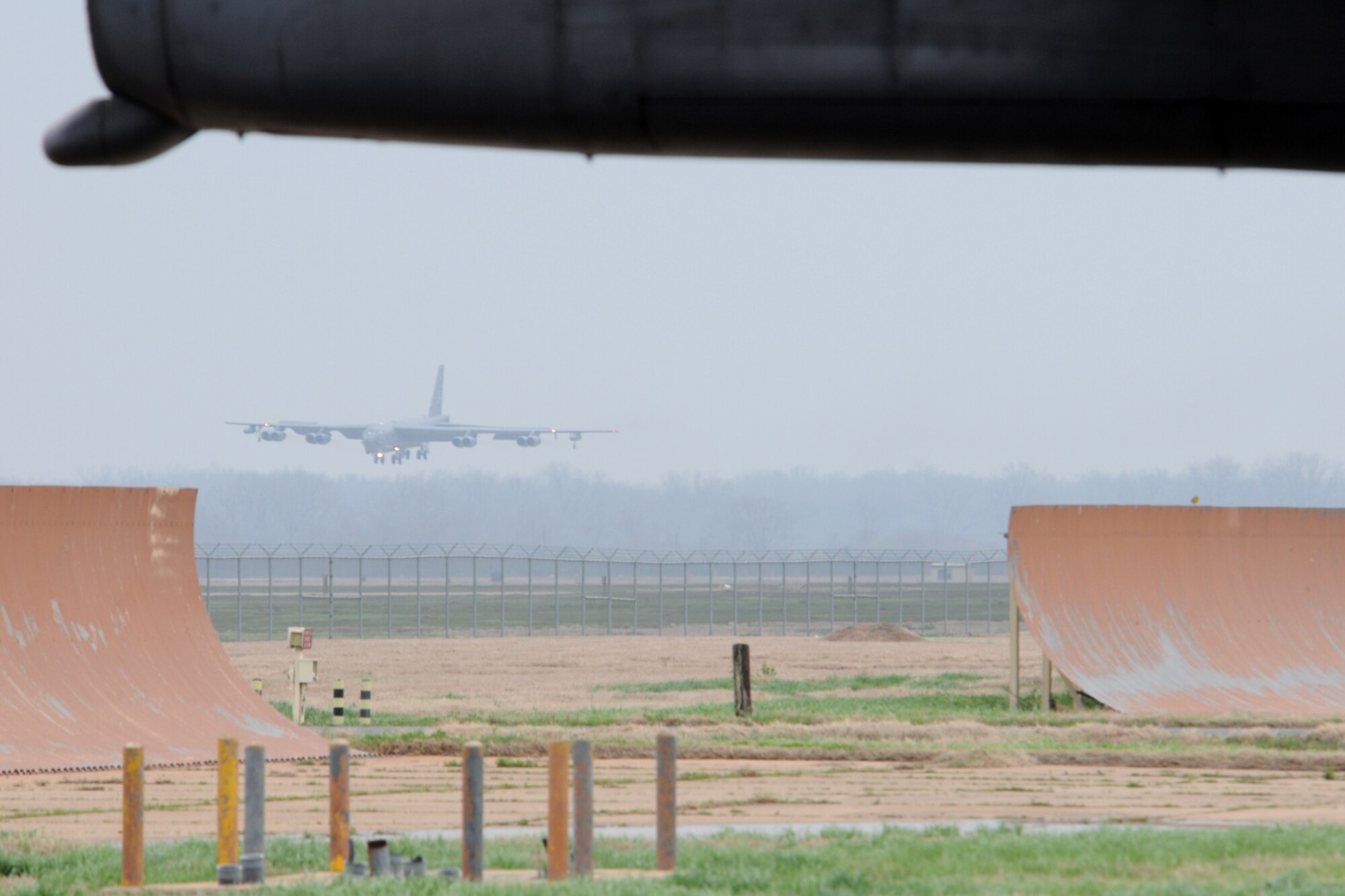 A 2nd Bomb Wing B-52H bomber, call sign Skull 61, comes in for a landing at Barksdale Air Force Base, La, March 5, 2011. Aircraft 60-008, the 8th Air Force flag ship, was crewed by Air Force Reserve members of the 343rd Bomb Squadron, which is a classic associate unit assigned to the 2nd BW. The launch of this crew and aircraft was significant for being the first supported by 2nd BW operations and maintenance personnel during a 307th Bomb Wing Reserve Unit Training Assembly. (U. S. Air Force Photo/Master Sgt. Greg Steele)