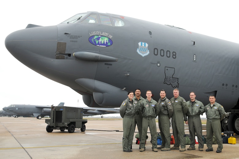 The aircrew of sortie Skull 61, tail number 60-008, take time for a group photo prior to takeoff of a nuclear training mission at Barksdale Air Force Base, La, March 5, 2011. All are Air Force Reservists assigned to the 343rd Bomb Squadron. The mission simulated the release of both nuclear Air Launched Cruise Missiles and gravity bombs. The launch of this crew and aircraft was significant for being the first supported by 2nd Bomb Wing operations and maintenance personnel during a 307th Bomb Wing Reserve Unit Training Assembly. The 343rd BS is a classic associate unit assigned to the 2nd BW. The members of the aircrew are Capt. Heather Decker, aircraft commander, Lt. Col. Marc Karup, instructor radar navigator, Capt. Chris Robinson, co-pilot, Lt. Col. Rafael Rodriguez, student radar navigator, Lt. Col. John Dorsey, electronic warfare officer, Capt. Andrew Marshall, radar navigator, and Maj. Jimmy Jackson, instructor pilot. (U. S. Air Force Photo/Master Sgt. Greg Steele)