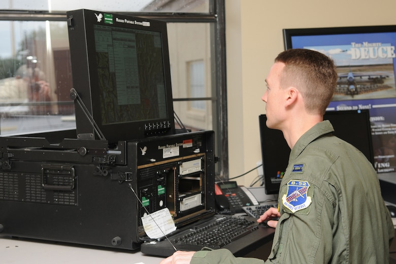 Capt. Chris Robinson, a 343rd Bomb Squadron co-pilot, uses the Air Force Mission Support System to input mission route, weapons configuration, aircraft weight and balance, and takeoff and landing data, before prior to a B-52H training sortie at Barksdale Air Force Base, La, March 5, 2011. The mission simulated the release of both nuclear Air Launched Cruise Missiles and gravity bombs. The launch of this crew and aircraft was significant for being the first supported by 2nd Bomb Wing operations and maintenance personnel during a 307th Bomb Wing Reserve Unit Training Assembly. The 343rd BS is a classic associate unit assigned to the 2nd BW. (U. S. Air Force Photo/Master Sgt. Greg Steele)