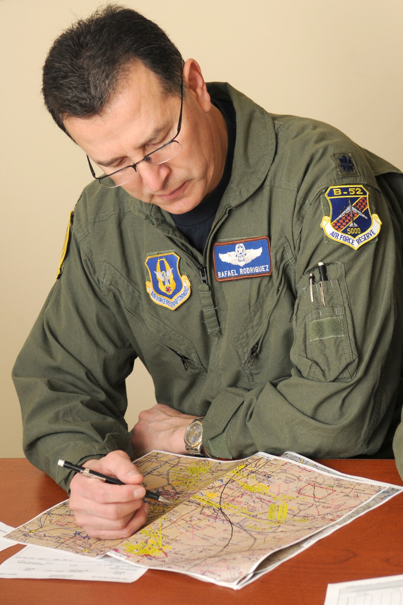 Lt. Col. Rafael Rodriguez, a 343rd Bomb Squadron student radar navigator, studies a mission map during a pre-flight briefing for a morning B-52H training sortie at Barksdale Air Force Base, La, March 5, 2011. The mission simulated the release of both nuclear Air Launched Cruise Missiles and gravity bombs. The launch of this crew and aircraft was significant for being the first supported by 2nd Bomb Wing operations and maintenance personnel during a 307th Bomb Wing Reserve Unit Training Assembly. The 343rd BS is a classic associate unit assigned to the 2nd BW. (U. S. Air Force Photo/Master Sgt. Greg Steele)
