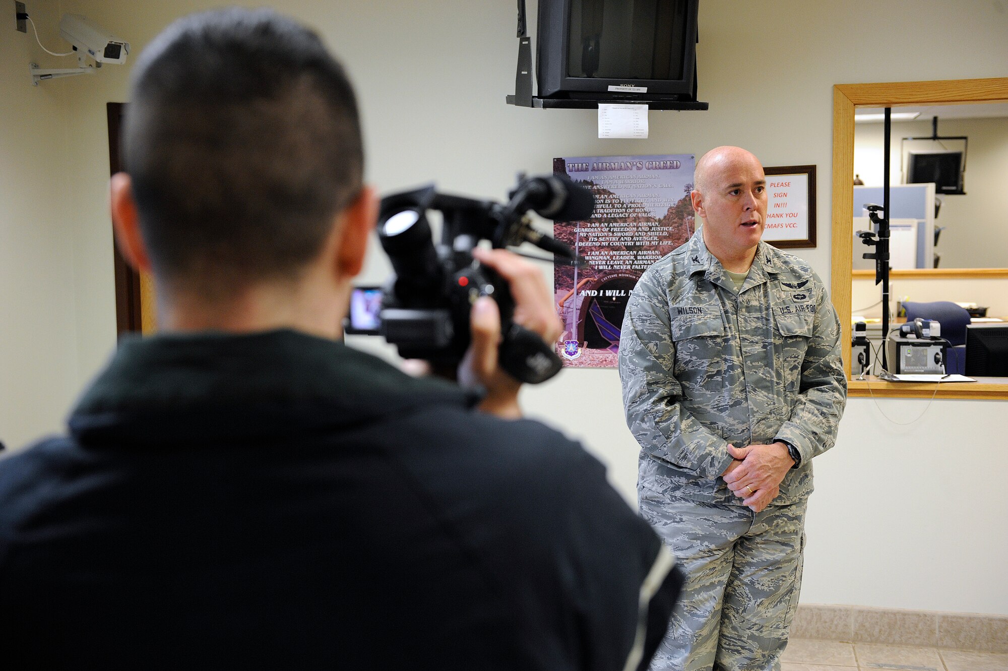 CHEYENNE MOUNTAIN AIR FORCE STATION, Colo. -- Col. Russell Wilson, 721st Mission Support Group commander, hosts a mock press conference March 7 as part of an emergency response scenario during the 21st Space Wing’s Operational Readiness Inspection, which continues through this week. In this scenario three people were injured as a result of a generator fire inside the CMAFS complex. CMAFS stood up its emergency operations center to assist the first responders and ensure maximum life safety and property protection measures were in place. The ORI tests the wing’s ability to perform deployment operations, emergency response actions and evaluates compliance with Department of Defense, Air Force, Headquarters Air Force Space Command and 21st Space Wing instructions. The Headquarters AFSPC Inspector General will brief the wing on its performance March 21. (U.S. Air Force photo/Craig Denton) 