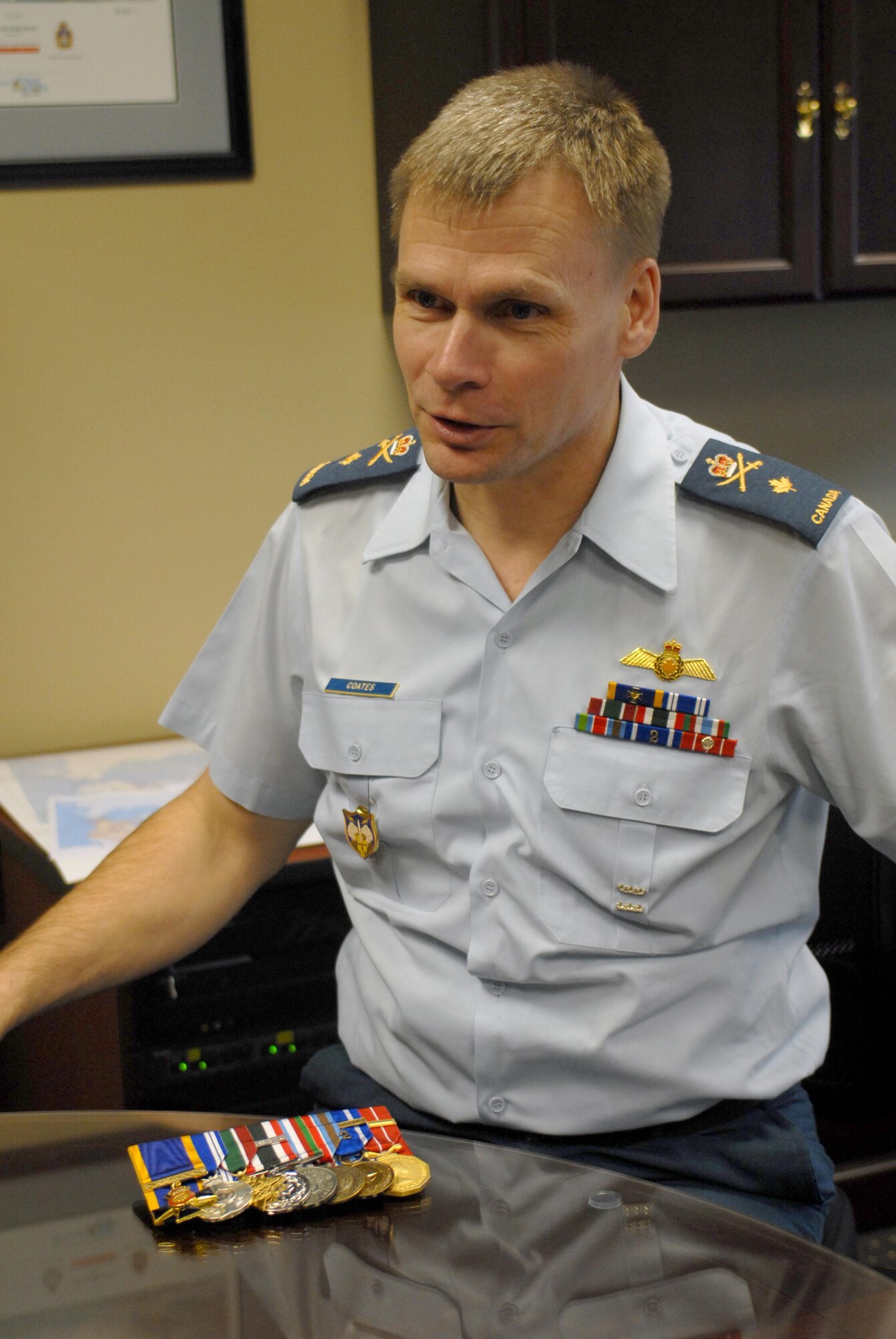 Brig. Gen. Christopher Coates, Continental U.S. North American Aerospace Defense Command Region deputy commander, shows the medals he’s earned throughout his career, to include his most recent – the Order of Military Merit, which is Canada’s second-highest honor for its military members. General Coates was inducted as an Officer of the Order of Military Merit in a ceremony Feb. 18 at Rideau Hall in Ottawa, Canada, by Governor General David Johnston, the representative of Queen Elizabeth II. (U.S. Air Force photo by Master Sgt. Jerry Harlan)