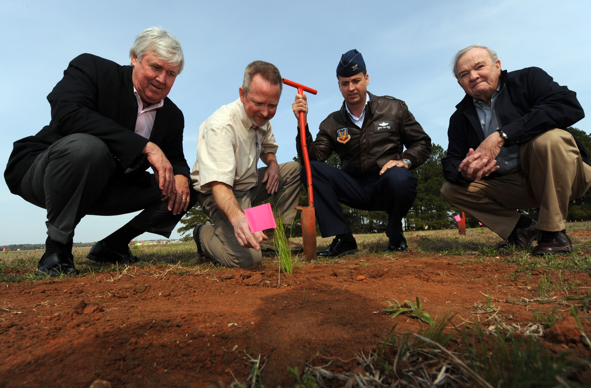 SHAW AIR FORCE BASE, S.C. - (left to right) Former Sumter Mayor Steve Creech, Chariman of the Chamber of Commerce Military Affairs Committee; Preston Fout, American Forest Management;  Colonel Charlie Moore, 20th Fighter Wing commander; and Bo Shaw, founder and director of American Forest Management, break ground to start the longleaf pine planting project March 14, 2011. Mr. Creech and Mr. Shaw worked together to purchase and donate 1,000 trees to the base.   (U.S Air Force Photo/ Tech. Sgt. Louis Rivers) 