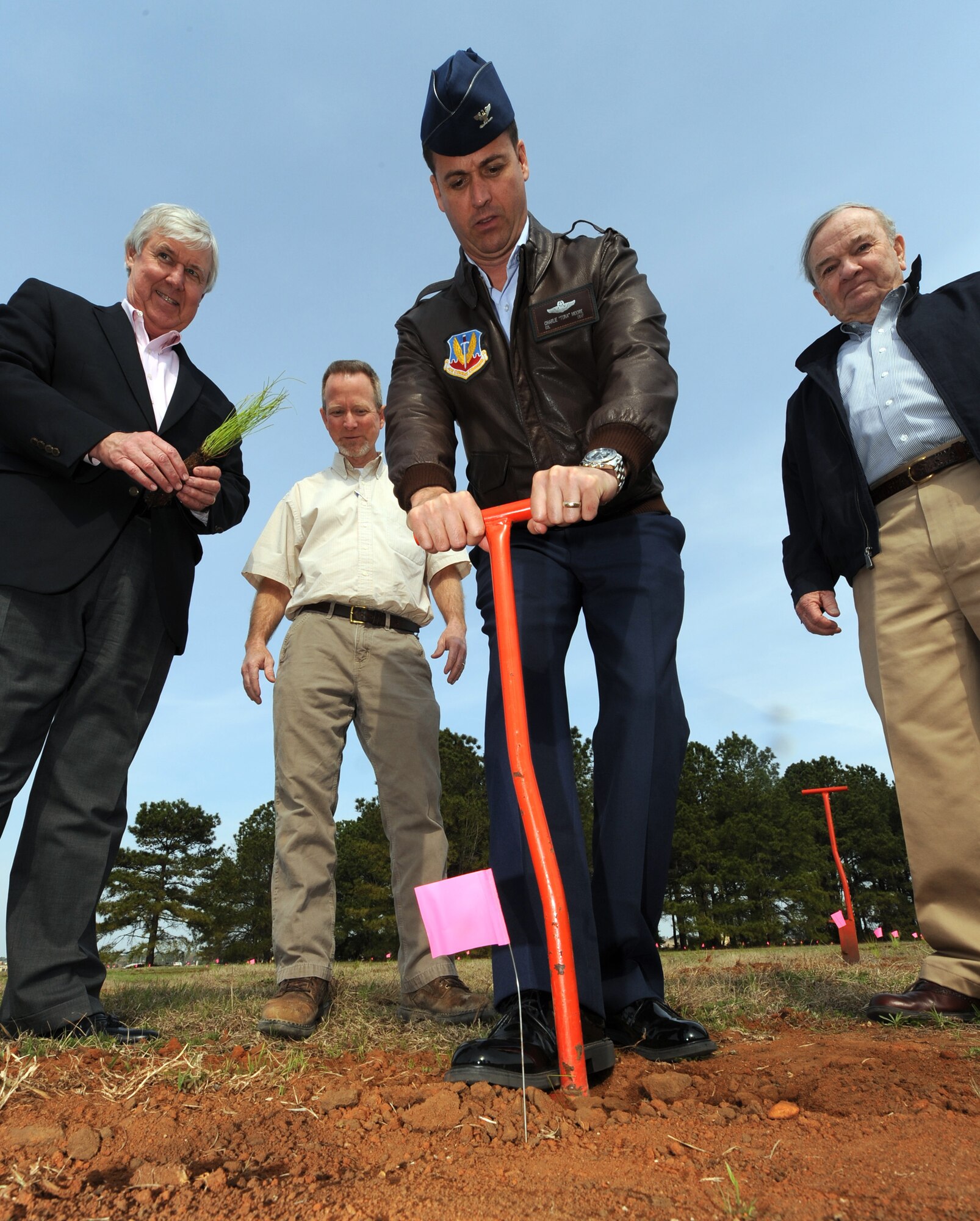 SHAW AIR FORCE BASE, S.C. - (left to right) Former Sumter Mayor Steve Creech, Chariman of the Sumter Chamber of Commerce Military Affairs Committee; Preston Fout, American Forest Management;  Colonel Charlie Moore, 20th Fighter Wing commander; and Bo Shaw, founder and director of American Forest Management, break ground for the planting of 1,000 longleaf pines March 14, 2011. Mr. Creech and Mr. Shaw worked together to purchase and donate the trees to the base for the  project.   (U.S Air Force Photo/ Tech. Sgt. Louis Rivers) 