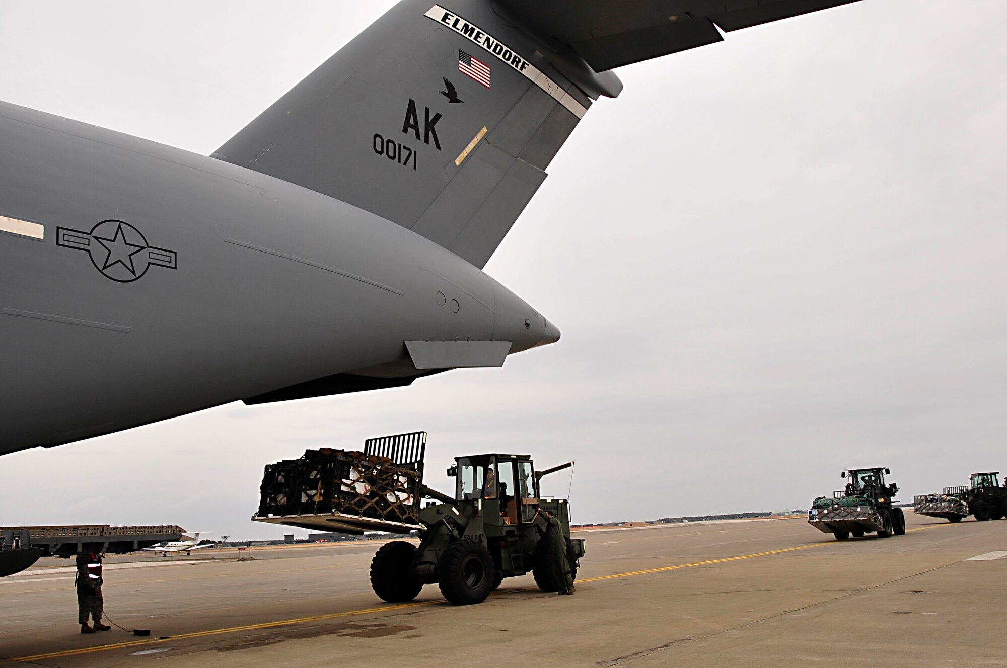 MISAWA AIR BASE, Japan -- A forklift loads cargo onto a U.S. Air Force C-17 Globe Master III Mar. 15. The 35th Logistic Readiness Squadron has moved 188 tons of cargo and 290 passengers since the start of Operation Tomodachi. (U.S. Air Force photo by Staff Sgt. Marie Brown\Released)