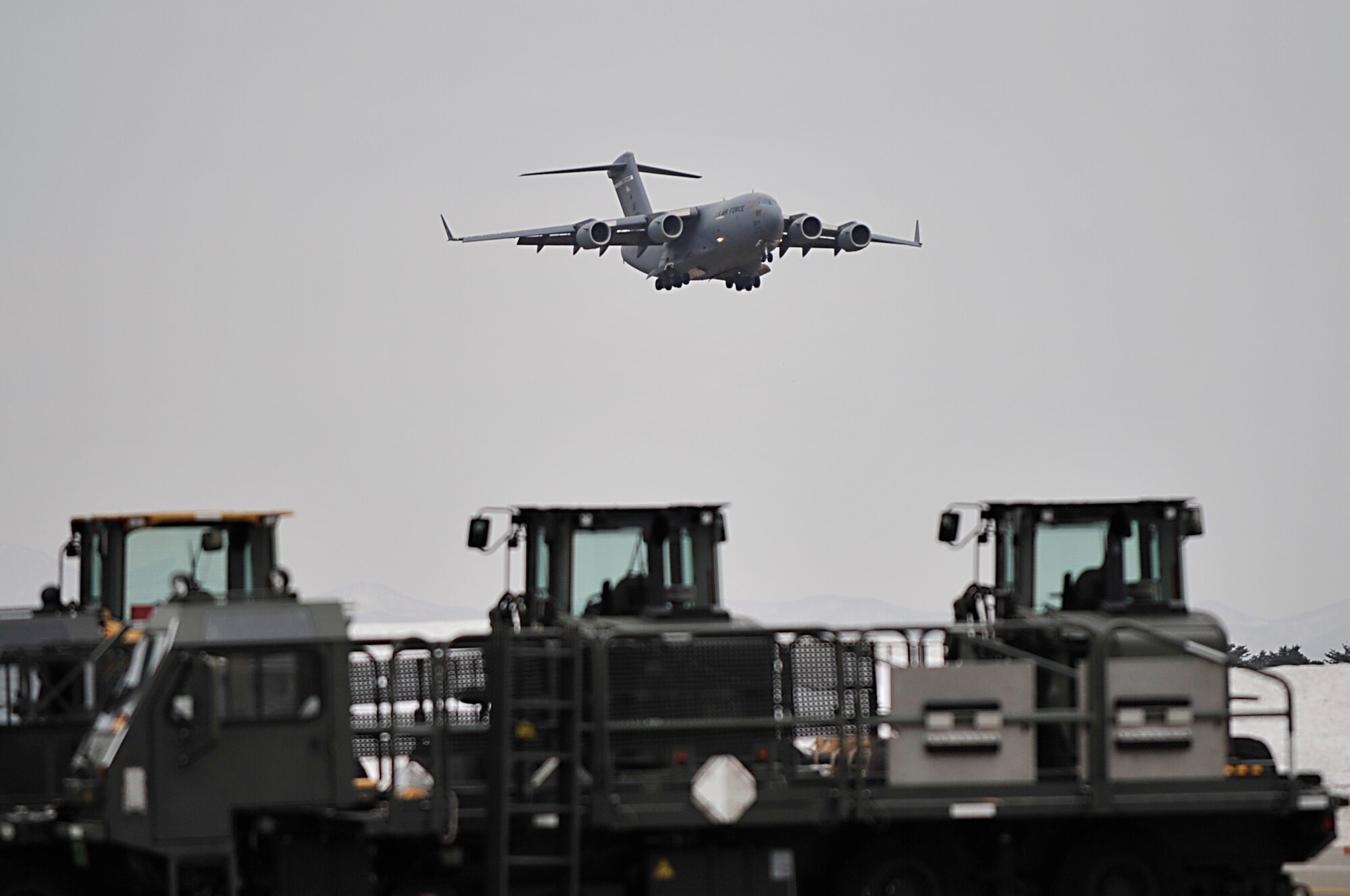 MISAWA AIR BASE, Japan -- A U.S. Air Force C-17 Globe Master III comes in for a landing here Mar. 15. The 35th Logistics Readiness Squadron is the unit responsible for unloading aircraft that arrive here laden with humanitarian relief supplies and passengers. (U.S. Air Force photo by Staff Sgt. Marie Brown\Released)
