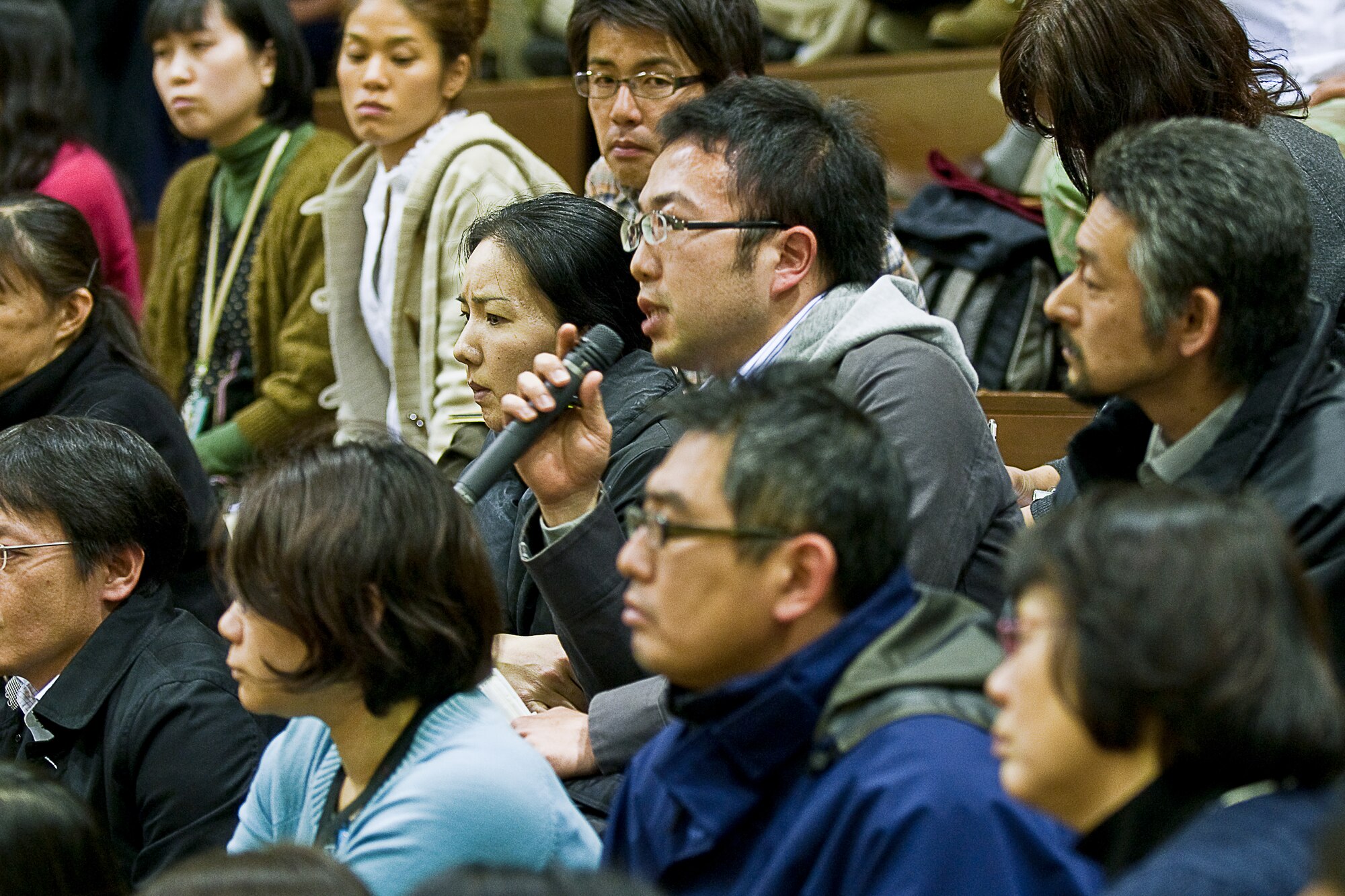 YOKOTA AIR BASE, Japan -- A Japanese national employee of the 374th Airlift Wing speaks to the base commander during a town hall meeting here March 15.
Col. Otto Feather, 374th AW commander, hosted the event to address concerns that base employees had following the earthquake and tsunami in Japan March 11. (U.S. Air Force photo/Staff Sgt. Robin Stanchak)

