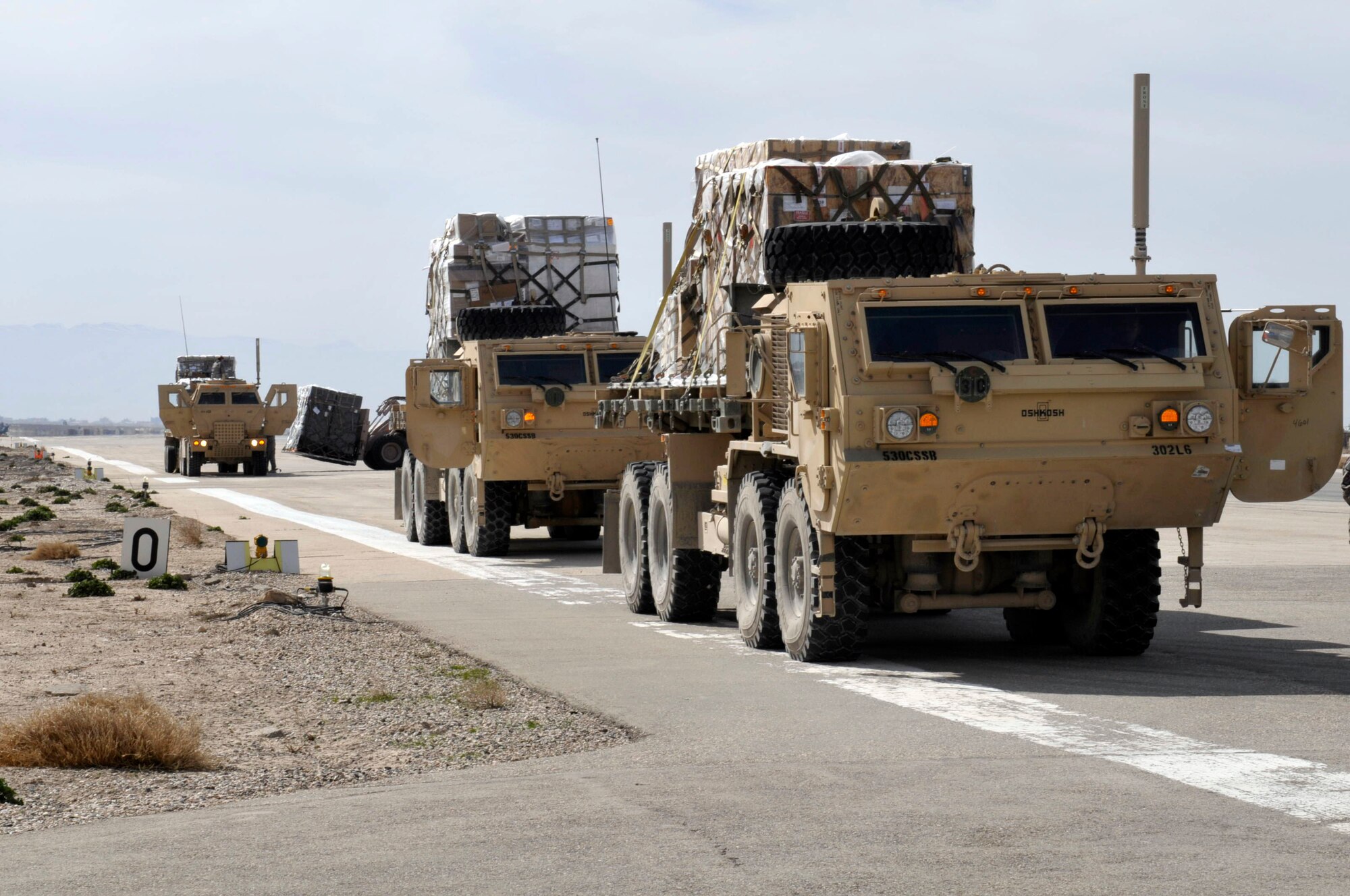 455th Expeditionary Aerial Port Squadron specialist off-load pallets from 747 March 10 at Camp Marmal, Mazar-e Sharif, Afghanistan. There are fourteen Airmen belonging to the 455th Expeditionary Aerial Port Squadron and 455th Expeditionary Logistics Readiness Squadrons are charged with unloading, loading and refueling every aircraft carrying supplies or personnel into and out of Camp Marmal supporting U.S. Transportation Command. (U.S. Air Force photo by Tech. Sgt. Michael Voss)