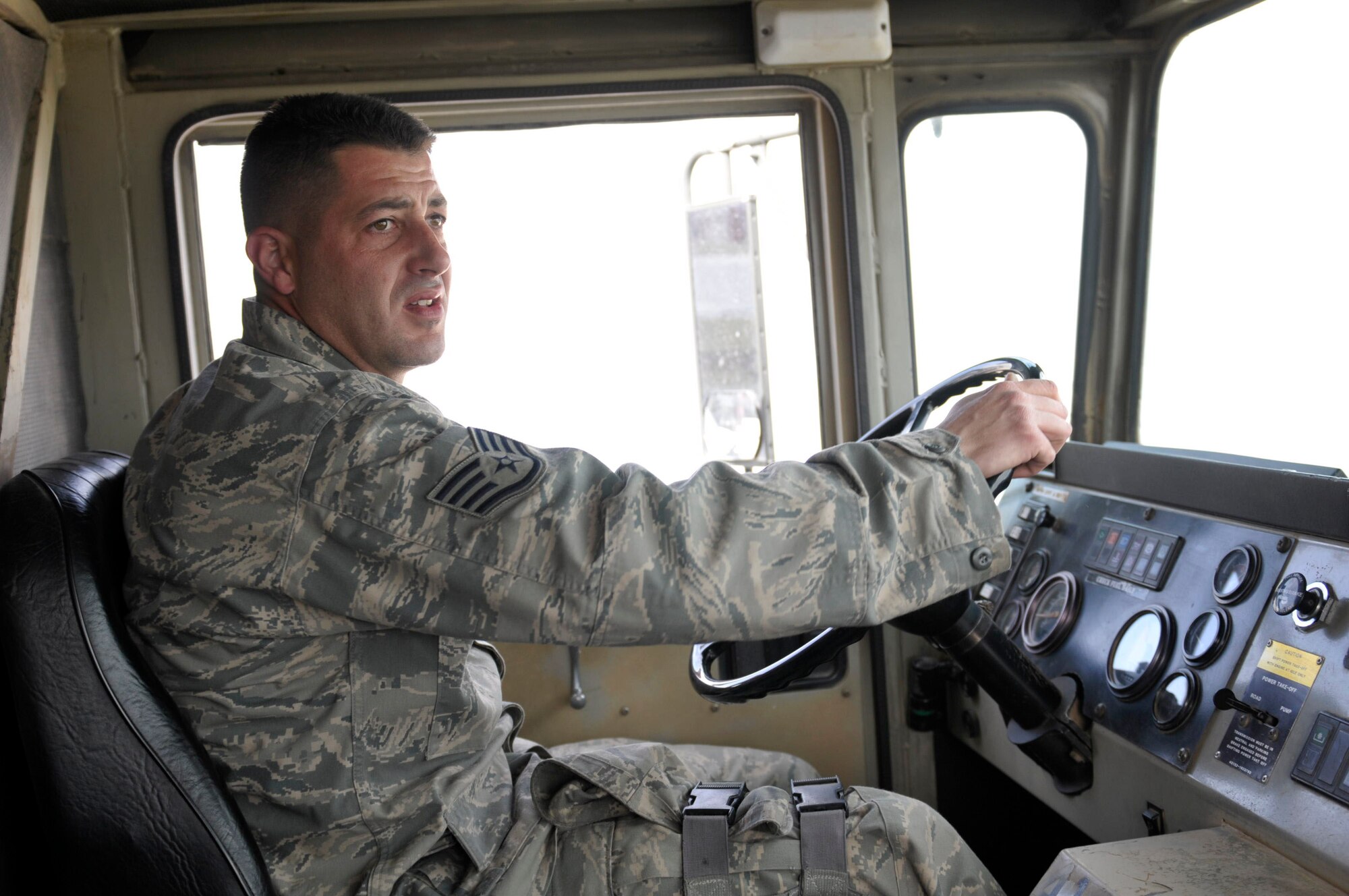 Staff Sgt. Michael Lance, 455th Expeditionary Logistics Readiness Squadron fuels specialist drives an R-11 fuel truck to delivery 6000 gallons of fuel to an awaiting 747 March 10 at Camp Marmal, Mazar-e Sharif, Afghanistan. Sergeant Lance is one of fourteen Airmen belonging to the 455th Expeditionary Aerial Port Squadron and 455th Expeditionary Logistics Readiness Squadrons are charged with unloading, loading and refueling every aircraft carrying supplies or personnel into and out of Camp Marmal supporting U.S. Transportation Command. (U.S. Air Force photo by Tech. Sgt. Michael Voss)