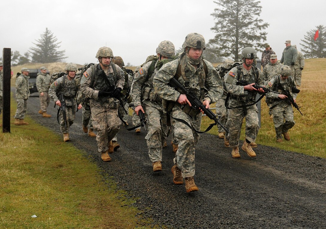 Army soldiers begin the 3-mile ruck run on Camp Rilea, Warrenton, Ore., March 12, 2011, and completed the run with a minimum of 35 pounds in their rucksacks. The soldiers were competing in the 2011 Oregon Army National Guard Best Warrior Competition. The three-day event pitted Oregon citizen-soldiers against one another for the title of Oregon’s Soldier and Noncommissioned Officer of the Year.