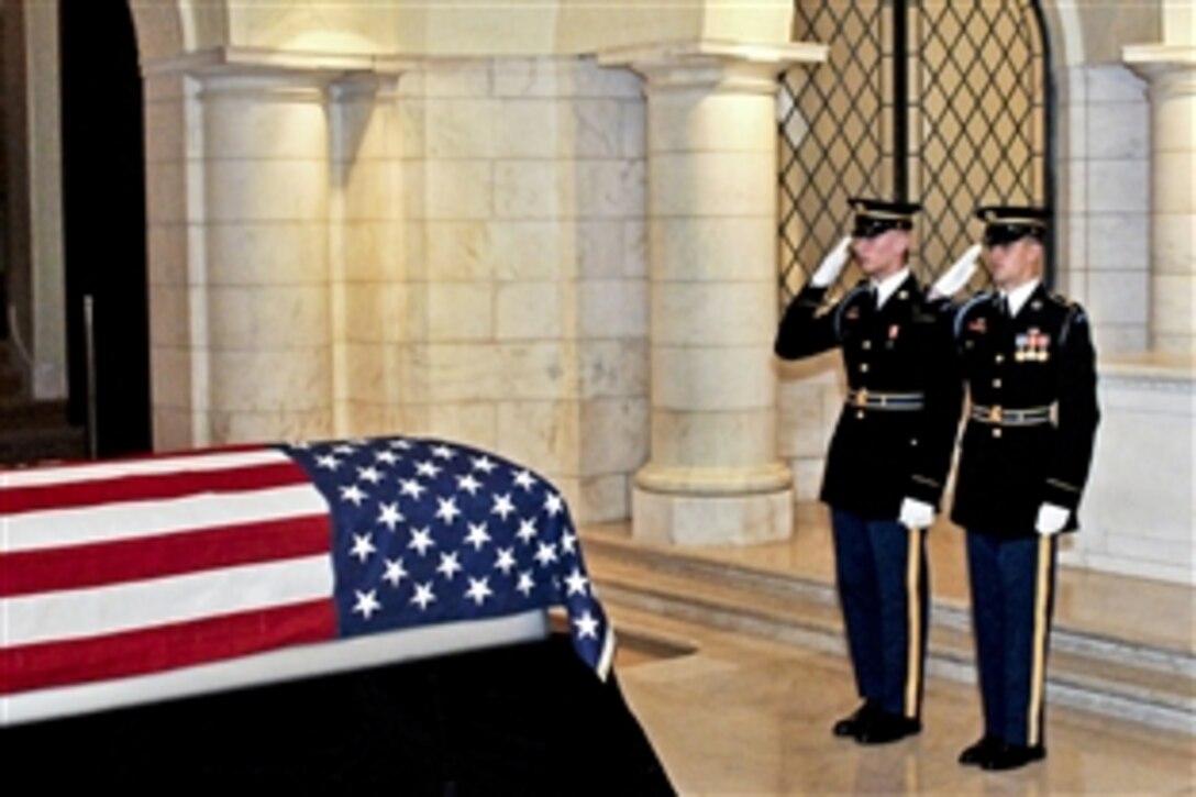 U.S. Army soldiers salute to honor Army Cpl. Frank Woodruff Buckles, the last American World War I veteran, during his viewing at the Memorial Amphitheater Chapel at Arlington National Cemetery, Arlington, Va., March 15, 2011. The soldiers are assigned to the 3rd U.S. Infantry Regiment (The Old Guard).