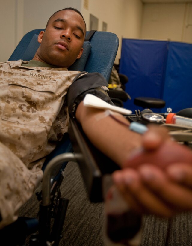 Cpl. Deandre A. Simms-Aguilar, an administration clerk with Headquarters and Service Battalion, U.S. Marine Corps Forces, Pacific, donates blood during a blood drive March 16 here. Donations to Armed Services Blood Program ensure service members and their families have the blood needed to treat numerous blood disorders, conduct surgical procedures and save lives.