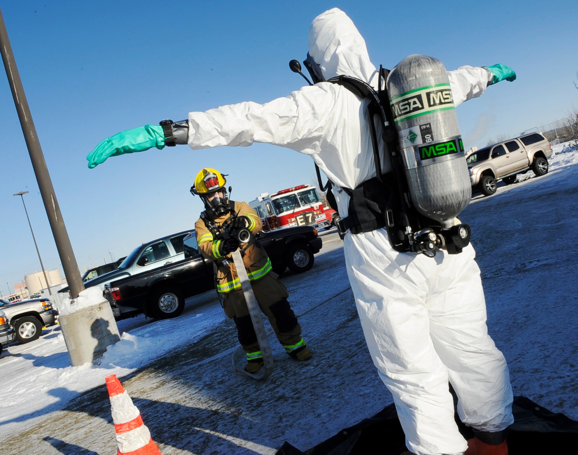 A first responder positions for decontamination after testing a simulated suspicious powder discovered at the snow barn during an operational readiness exercise March 11, 2011, Eielson Air Force Base, Alaska. Responders were required to wear personal protective equipment to simulate a real world chemical threat. (U.S. Air Force photo/Airman 1st Class Laura Goodgame) 