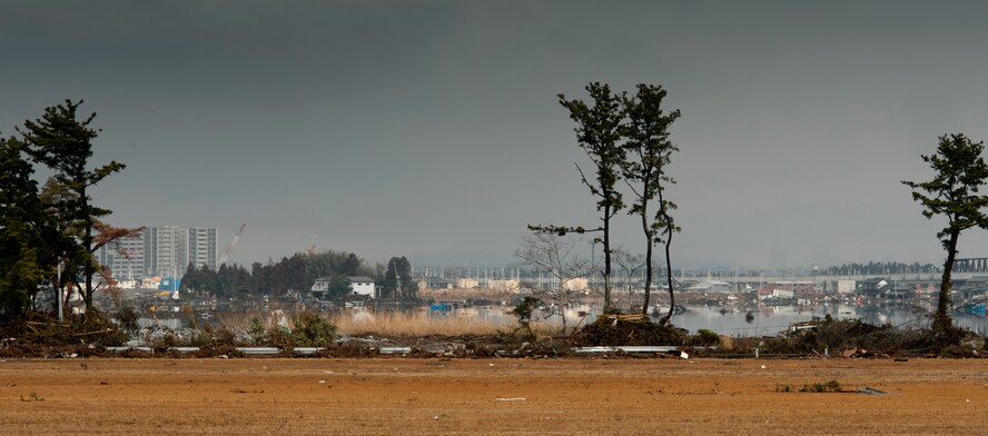 SENDAI AIRPORT, Japan -- Debris covers the shores and low-lying ground around Sendai Airport here March 16. Members of the 320th Special Tactics Squadron, stationed out of Kadena Air Base, deployed to Sendai Airport to help clear the runway and make it ready for fixed-wing aircraft traffic. (U.S. Air Force photo/Staff Sgt. Samuel Morse)
