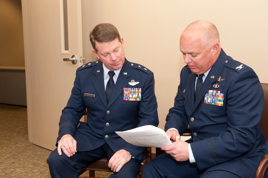 Major Gen. John Nichols, new Adjutant General, Texas Military Forces discus the ceremony agenda with Col. Kevin Turnbo, new commander for the 254th Combat Communications Group for Col. Will Allen's retirement ceremony at Hensley Field, Texas, March 6, 2011. Col. Turnbo took command of the 254 CCG March 5, 2011. (U.S. Air Force photo by Senior Master Sgt. Elizabeth Gilbert/released)