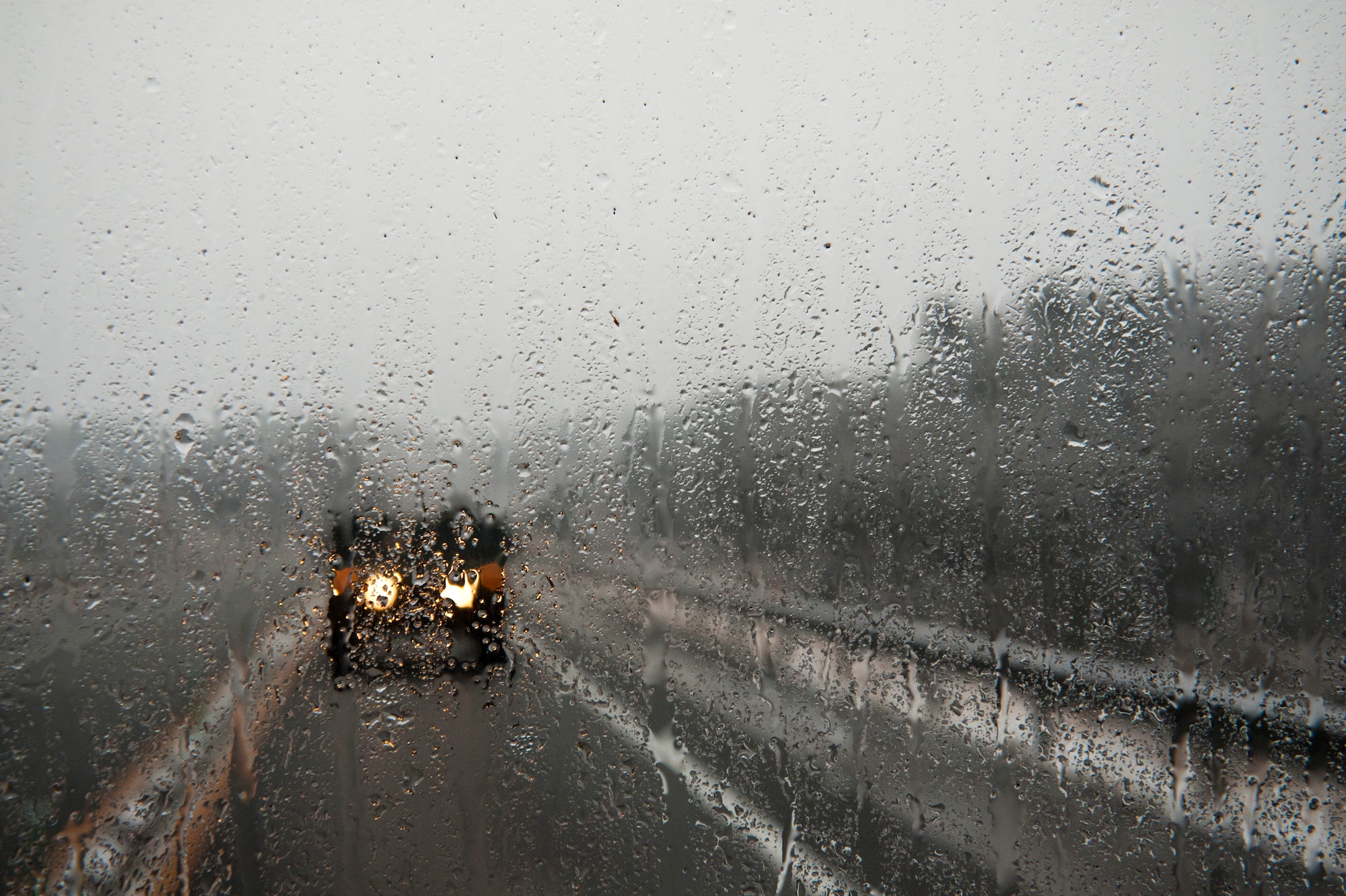 MIYAGI PREFECTURE, Japan -- A humvee carrying Airmen from the 320th Special Tactics Squadron travels down a Japanese highway towards Sendai Airport here March 16. Members of the 320th STS, stationed out of Kadena Air Base, deployed to Sendai Airport to help clear the runway and make it ready for fixed-wing aircraft traffic. (U.S. Air Force photo/Staff Sgt. Samuel Morse)