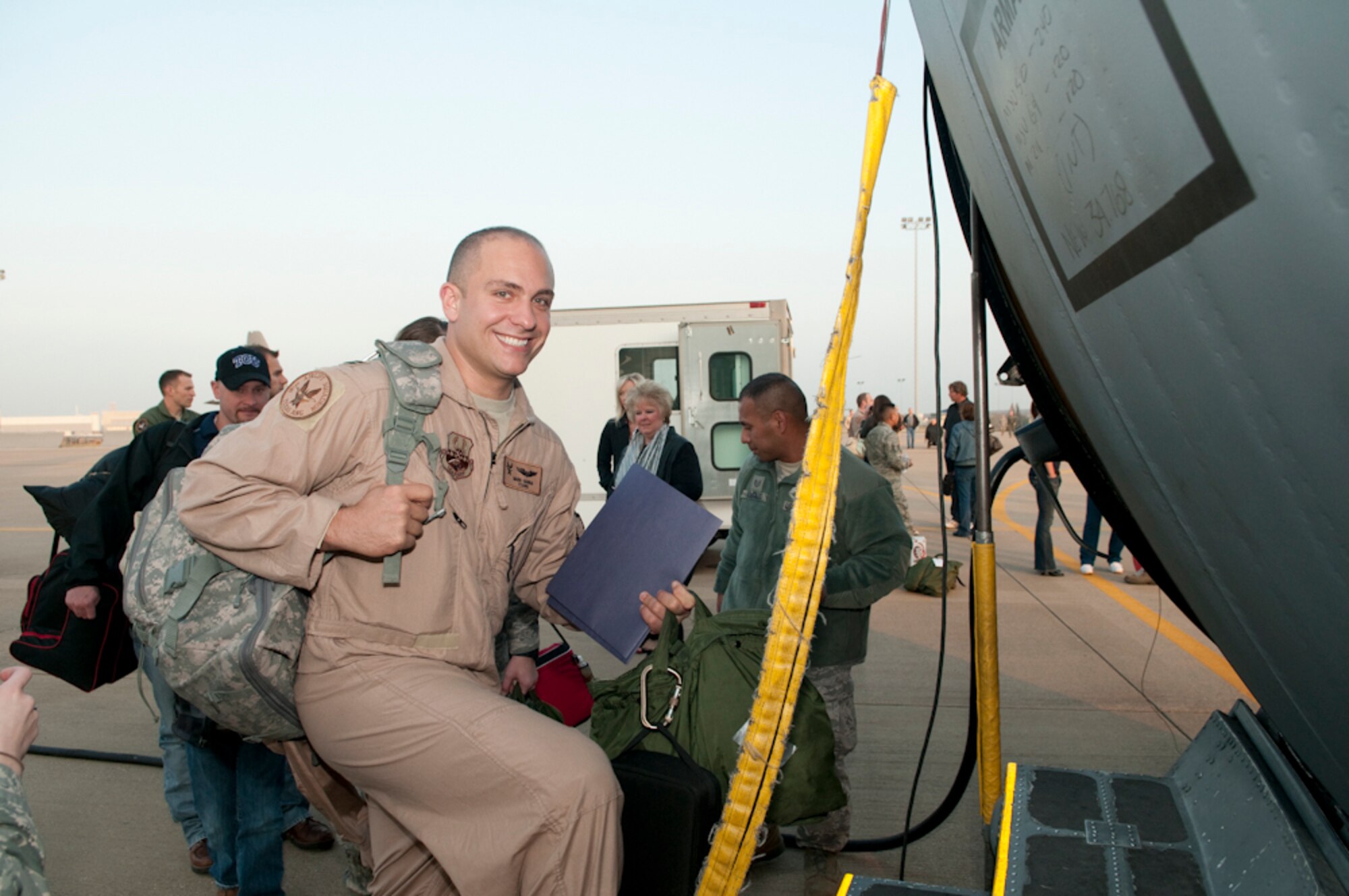 Capt. Mark Hanna, 181st Airlift Squadron boards C-130H aircraft at NAS Fort Worth JRB for his passageway to Afghanistan March 16, 2011. More than 140  deployers will be departing from the 136th Airlift Wing in support of Operation Enduring Freedom. (U.S. Air Force photo by Senior Master Sgt. Elizabeth Gilbert/released)