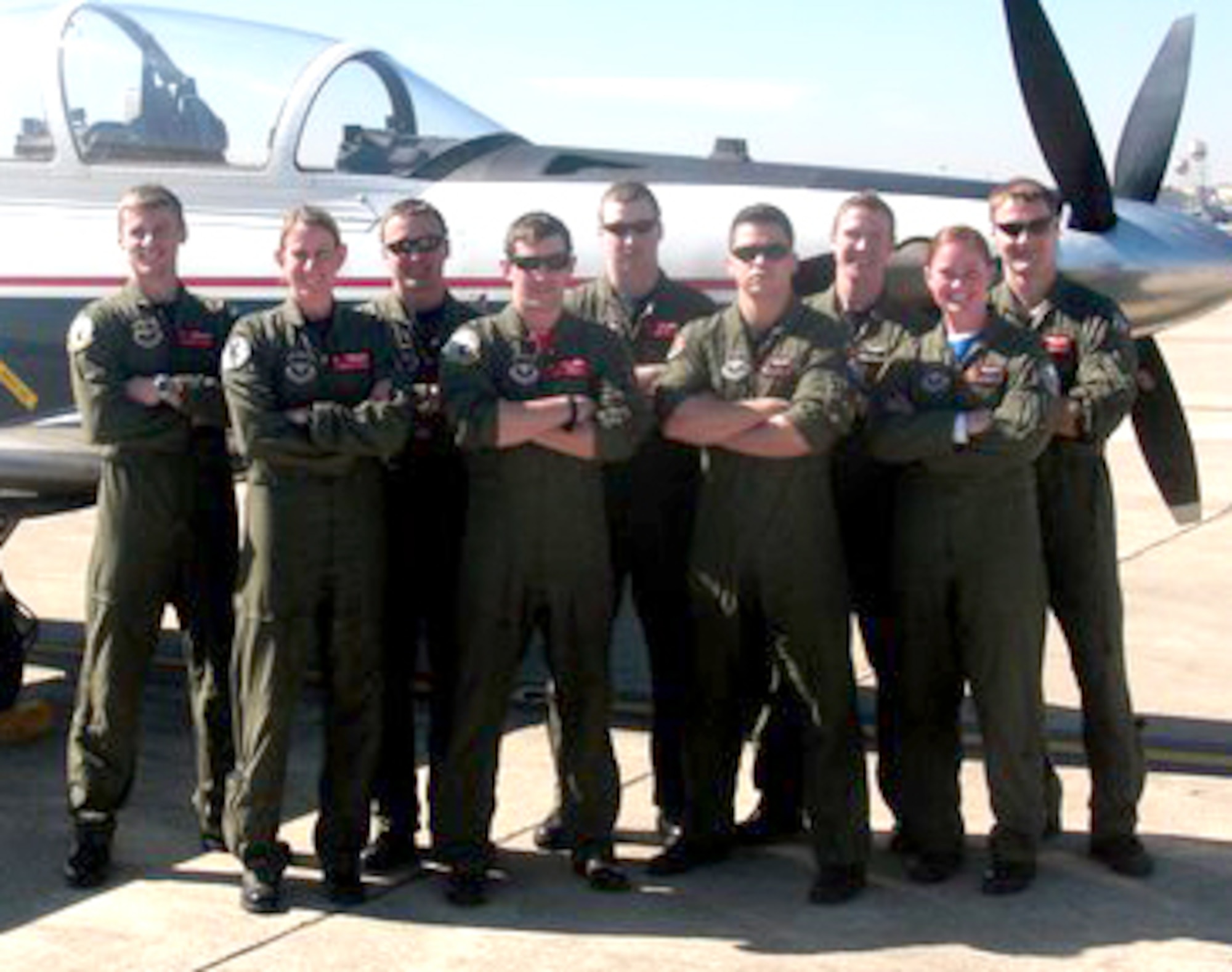 Warriors of the Week are, from left, 1st Lt. Andrew "Ice" Bergman, 1st Lt. Chandra "Carnie" Bartel, Capt. Eric "SLAB" Broyles, 1st Lt. Joe "Gherkin" Calcitrai, Capt. John "Deet" Avery, 1st Lt. Derek "Rex" Karr, Capt. Brent "Cougar" Cox, 1st Lt. Kristen "Chum" Smith and 1st Lt. Eric "Crunch" Antonietti, all T-6 Texan II instructor pilots at Vance AFB. (U.S. Air Force photo)