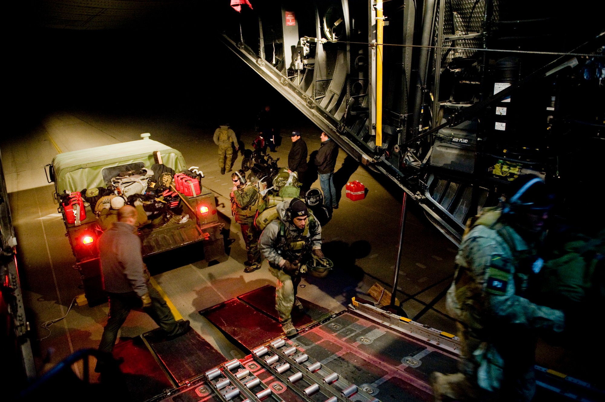 SENDAI, Japan -- Members from the 320th Special Tactics Squadron download and upload new gear at Sendai Airport March 16. The crew brought water, food, fuel and other general supplies to the members of the 353rd Special Operations Group at Sendai for search and rescue missions. The 353rd Special Operations Group is establishing a usable runway at Sendai Airport to help with Japan's earthquake and tsunami relief. (U.S. Air Force photo/Staff Sgt. Jonathan Steffen)