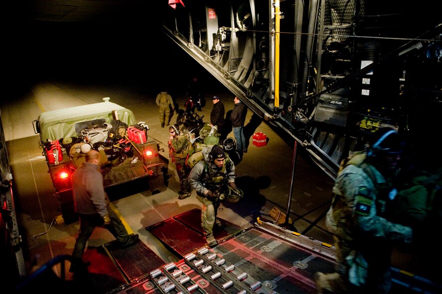 SENDAI, Japan -- Members from the 320th Special Tactics Squadron download and upload new gear at Sendai Airport March 16. The crew brought water, food, fuel and other general supplies to the members of the 353rd Special Operations Group at Sendai for search and rescue missions. The 353rd Special Operations Group is establishing a usable runway at Sendai Airport to help with Japan's earthquake and tsunami relief. (U.S. Air Force photo/Staff Sgt. Jonathan Steffen)