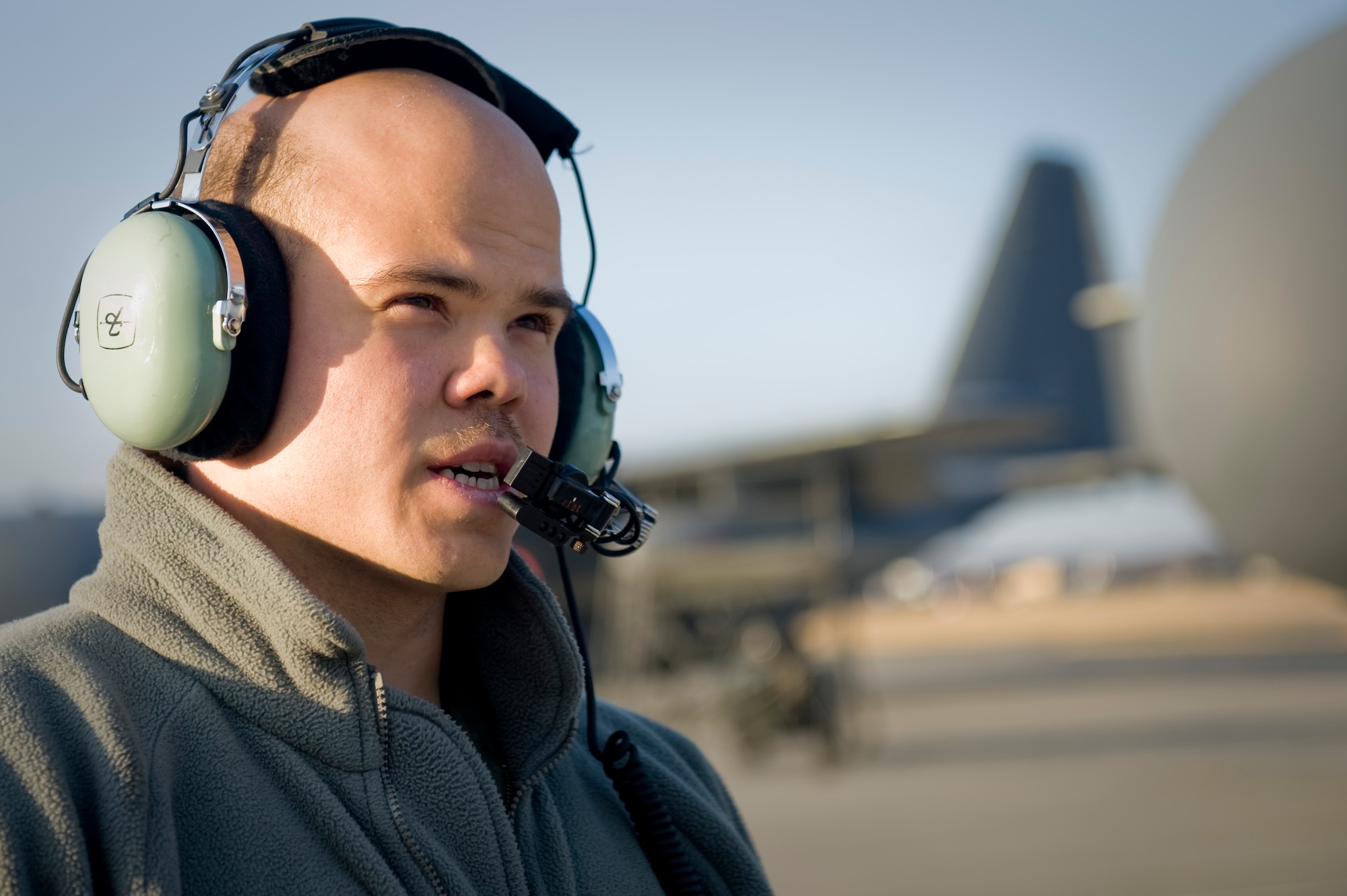 YOKOTA AIR BASE, Japan -- Senior Airman Ramon Mortensen, 17th Special Operations Squadron, converses with pilot about preflight checklist before heading out to Sendai Airport March 16. The crew brought water, food, fuel and other general supplies to the members of the 353rd Special Operations Group at Sendai for search and rescue missions. The 353rd Special Operations Group is establishing a usable runway at Sendai Airport to help with Japan's earthquake and tsunami relief. (U.S. Air Force photo/Staff Sgt. Jonathan Steffen)