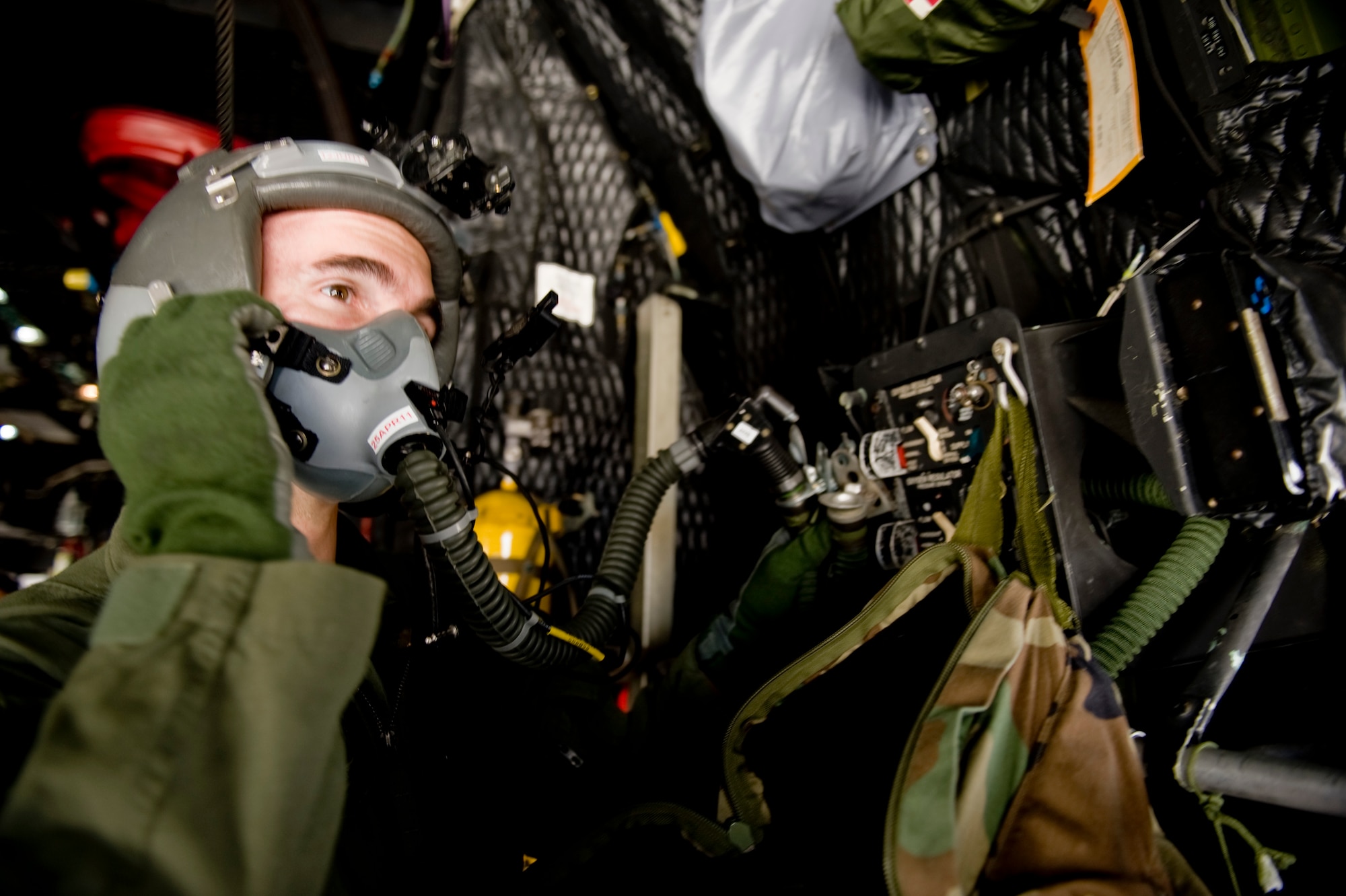 YOKOTA AIR BASE, Japan -- Master Sgt. Mike Milich, 17th Special Operations Squadron, tests the emergency oxygen systems on board MC-130P prior to flying supplies to Sendai Airport March 16. The crew brought water, food, fuel and other general supplies to the members of the 353rd Special Operations Group at Sendai for search and rescue missions. The 353rd Special Operations Group is establishing a usable runway at Sendai Airport to help with Japan's earthquake and tsunami relief. (U.S. Air Force photo/Staff Sgt. Jonathan Steffen)