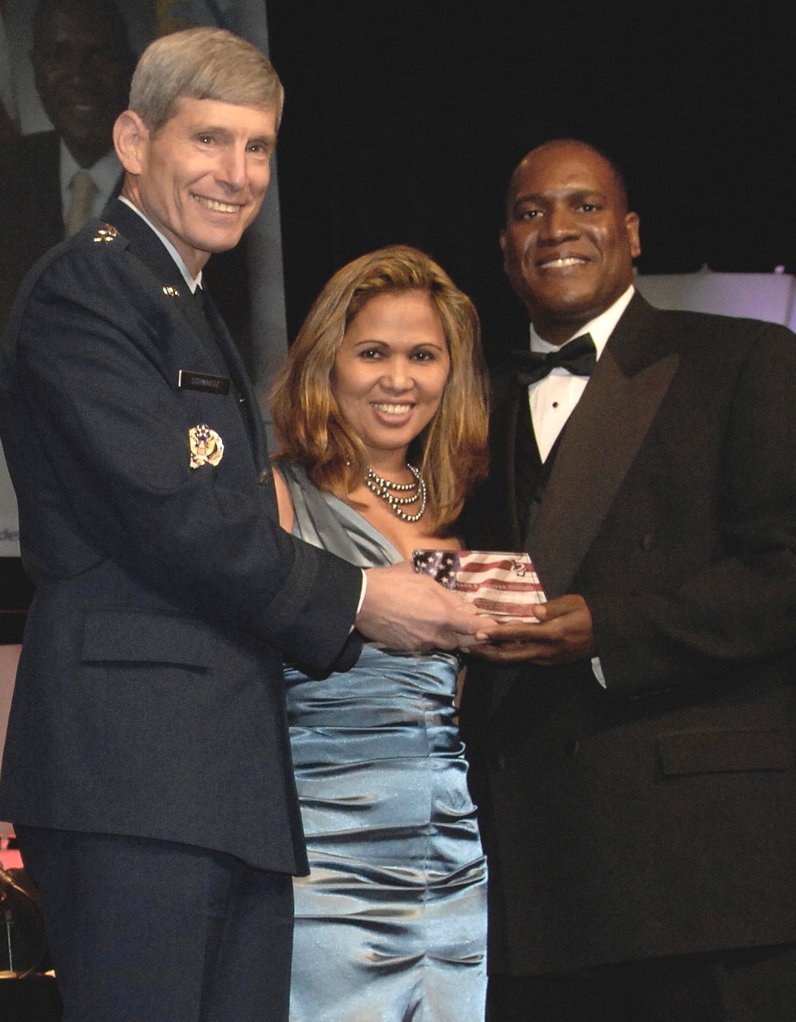 Air Force Chief of Staff Gen. Norton Schwartz poses with Dr. Jarris L. Taylor Jr. and his wife, Maria Taylor, during the 2011 Black Engineer of the Year Award ceremony Feb. 18, 2011, in Baltimore, Md. Dr. Taylor is the deputy assistant secretary of strategic diversity integration. (U.S. Air Force photo/Staff Sgt. Tiffany Trojca)