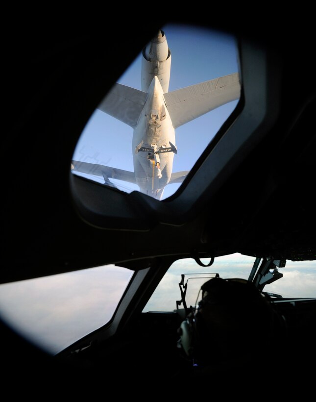 An U.S. Air Force KC-10 Extender from the 349th Air Mobility Wing prepares to perform an aerial refueling of an U.S. Air Force C-17 Globemaster III while it is en route to Japan with a Search and Rescue team during an emergency response on March 12, 2011. Aircrew from the 4th Airlift Squadron, McChord Air Force Base, Wash. are transporting members and equipment of the Los Angeles Search and Rescue team to Japan to aid in recovery and care of the victims of the recent earthquake. (U.S. Air Force photo by Technical Sgt. Daniel St. Pierre)