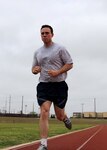 Having achieved his farthest run to date (seven miles) in training, Senior Airman Forrest Bradley continues to increase his workload just weeks from his first half marathon in Austin, April 16. (U.S. Air Force photo/Tony Morano)