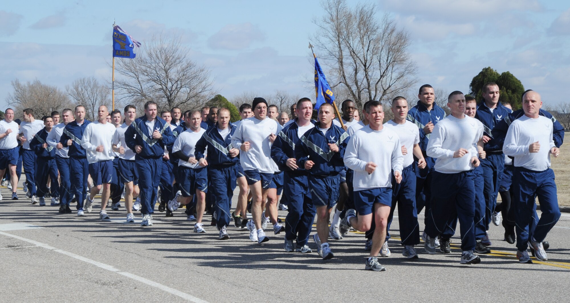 Col. Jamie Crowhurst, 22nd Air Refueling Wing commander, Senior Airman Lucas Shepard, 22nd Maintenance Squadron unit fitness program manager,  and Chief Master Sgt. Michael Edwards, 22nd ARW command chief,  lead the wing run March 14, 2011, McConnell Air Force Base, Kan. The wing run is held quarterly and is used to emphasize physical fitness and increase morale. (U.S. Air Force photo/Airman 1st Class Katrina M. Brisbin)