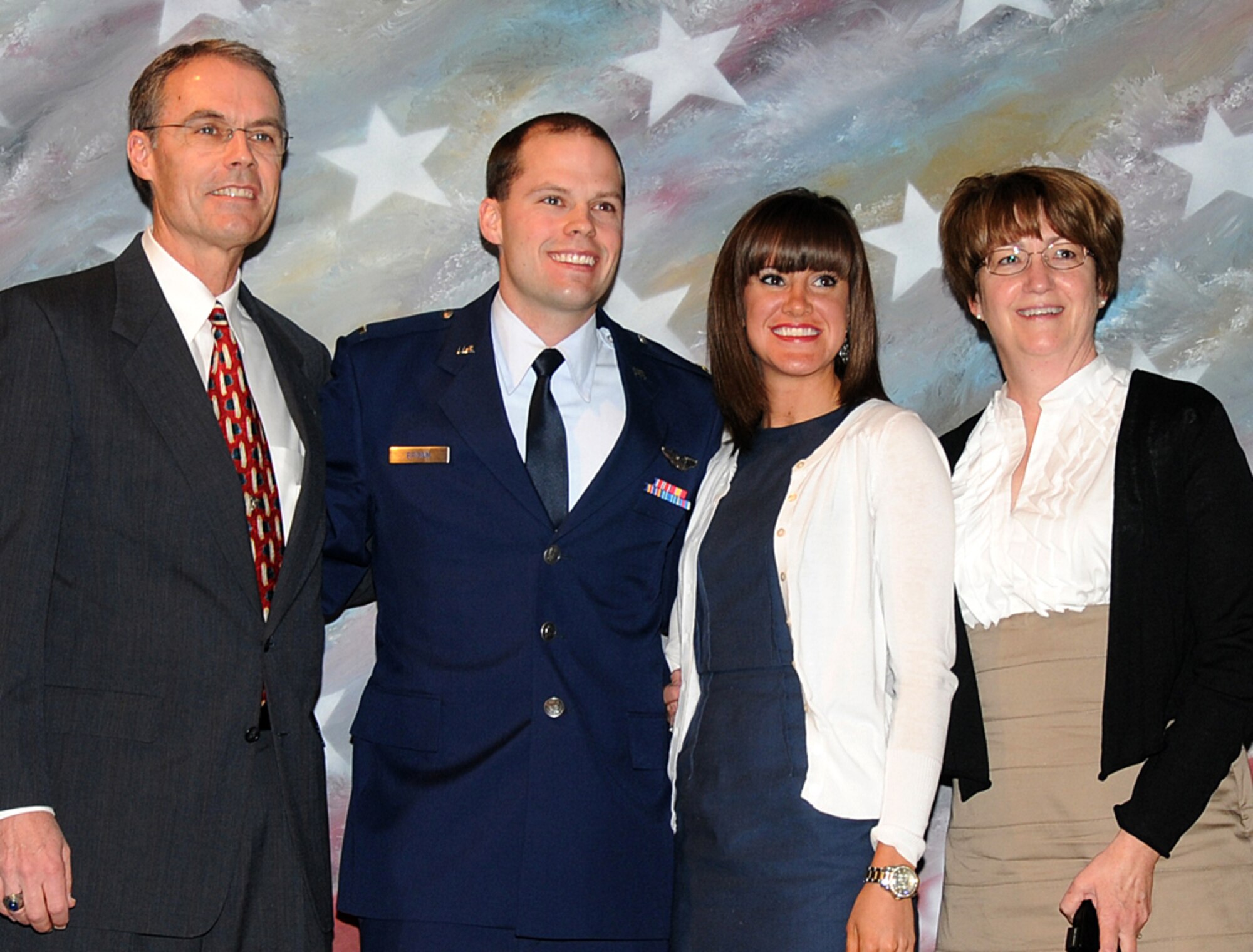 From left, retired Air Force Lt. Col. Tim Brown pinned on 2nd Lt. David Brown’s pilot wings during the March 11 graduation ceremony at Vance AFB for Joint Specialized Undergraduate Pilot Training Class 11-06. Also attending the graduation were Lieutenant Brown’s fiancée, Natalie Thomas, and his mother, Jem Brown. (U.S. Air Force photo/ Angie Roche)