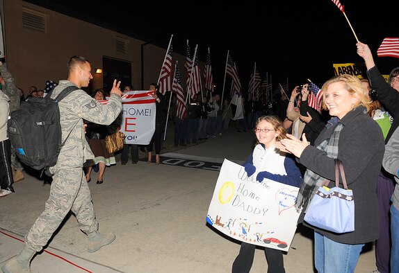 SEYMOUR JOHNSON AIR FORCE BASE, N.C. – Airmen from the 4th Fighter Wing  are greeted by a crowd of family members and friends as they return from deployment March 15, 2011. Approximately 300 Airmen from the 336th Fighter Squadron, 4th Aircraft Maintenance Squadron, 4th Component Maintenance Squadron and the 4th Equipment Maintenance Squadron returned from a deployment to Afghanistan in support of Operation Enduring Freedom. (U.S. Air Force photo/ Senior Airman Gino Reyes)(RELEASED)
