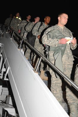 SEYMOUR JOHNSON AIR FORCE BASE, N.C. – 4th Fighter Wing Airmen de-board an aircraft to be reunited with their loved ones March 15, 2011.  Approximately 300 Airmen from the 336th Fighter Squadron, 4th Aircraft Maintenance Squadron, 4th Component Maintenance Squadron and the 4th Equipment Maintenance Squadron returned from a deployment to Afghanistan in support of Operation Enduring Freedom. (U.S. Air Force photo/ Senior Airman Gino Reyes)(RELEASED)