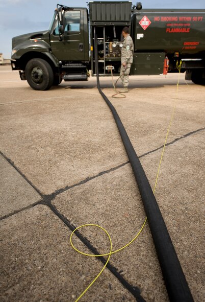 Airman 1st Class Marvin Scandrett, 2nd Logistics Readiness Squadron, operates the fuel truck during a B-52H Stratofortress ground refuel on the flightline at Barksdale Air Force Base, La., March 16. The B-52 is able to receive fuel on land as well as in the air, giving it a diverse array of capabilities and an unlimited range. (U.S. Air Force photo/Senior Airman Chad Warren)(RELEASED)