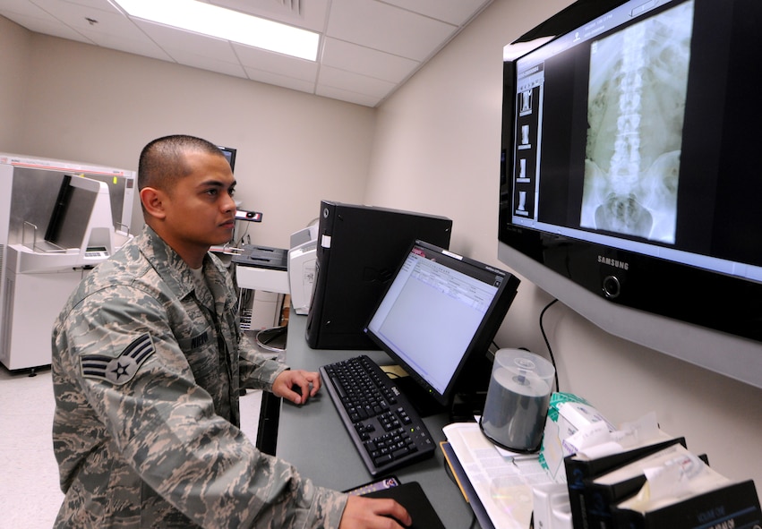 MOODY AIR FORCE BASE, Ga.-- Senior Airman Jack Nierva, 23rd Medical Group diagnostic imaging, scans over an x-ray March 16. Each technician is responsible for ensuring the x-ray is properly exposed and positioned for the primary care manager.  (U. S. Air Force photo/Airman 1st Class Benjamin Wiseman)(RELEASED)