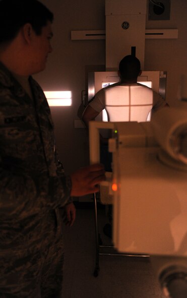 MOODY AIR FORCE BASE, Ga.-- Senior Airman Chris Kingsbury, 23rd Medical Group diagnostic imaging, lines up the x-ray on Senior Airmen Jack Nierva, 23rd MDG diagnostic imaging, while practicing routine procedures March 16. The 23rd MDG conducts training every Wednesday. (U. S. Air Force photo/Airman 1st Class Benjamin Wiseman)(RELEASED)
