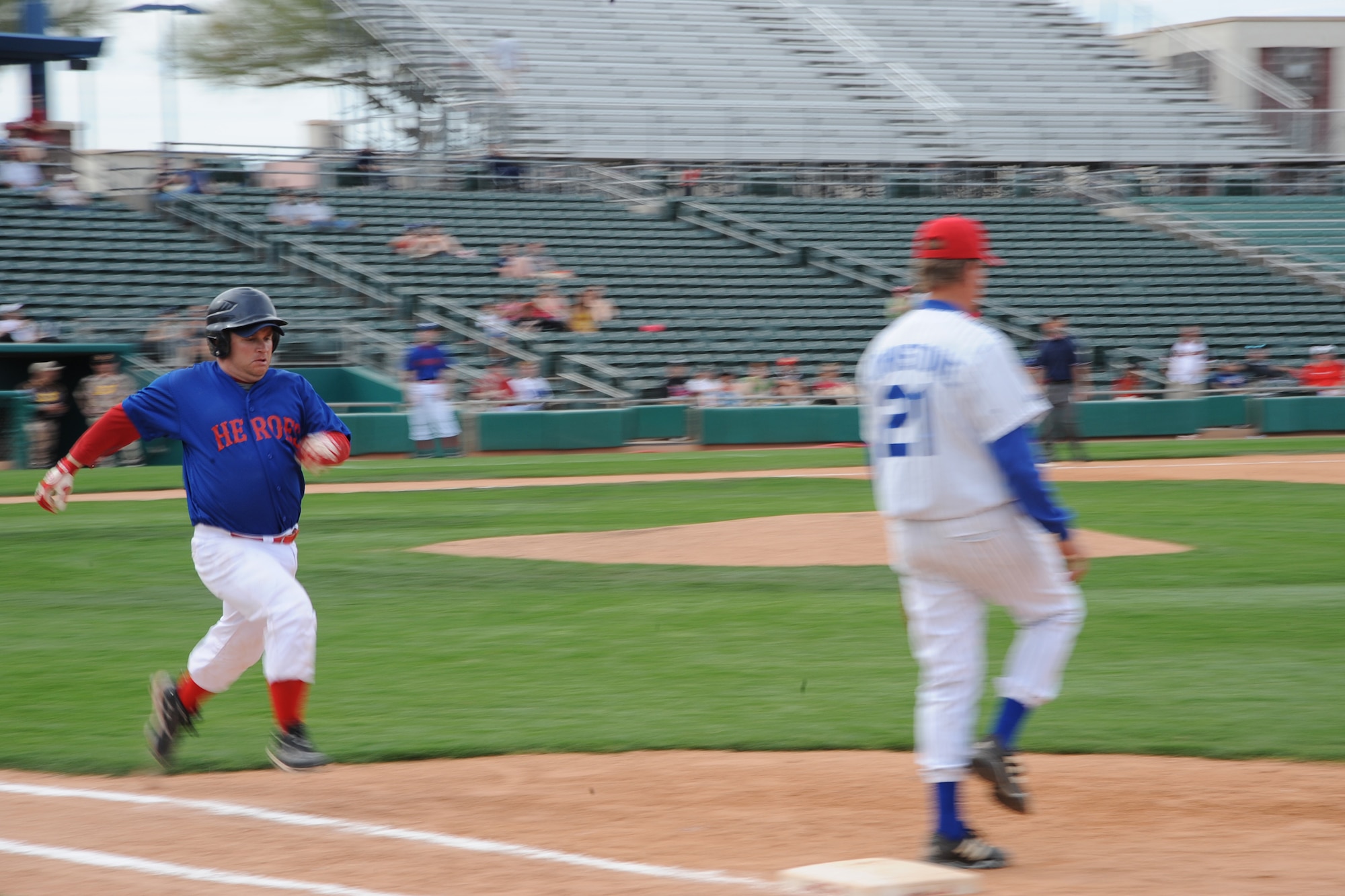 TUCSON, Ariz. - Heroes catcher Michael Holly runs to first base during the Wounded Heroes Baseball Classic held at the AZ Veterans Memorial Stadium here March 12. The Heroes defeated the Major League Baseball Legends team, 11-2. (U.S. Air Force photo/Tech Sgt Christopher Campbell)