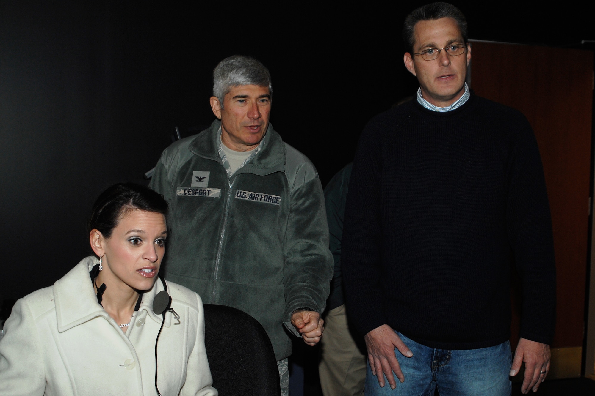 GRISSOM AIR RESERVE BASE, Ind. -- Jessica Mullins, a project manager with a local contracting company, takes her shot at directing air traffic in an air traffic control tower simulator here March 15 as Col. Nicholas Desport and Robert Moore watch. Ms. Mullins and Colonel Desport, Air Force Reserve Command A7 deputy director of installations, were at Grissom as part of a groundbreaking ceremony for a new ATC tower here. Mr. Moore is an air traffic training manager with the 434th Operations Support Squadron. (U.S. Air Force photo/Senior Airman Damon Kasberg)